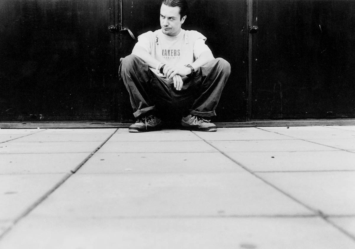 Mike Patton sitting in front of a black door HD Wallpaper