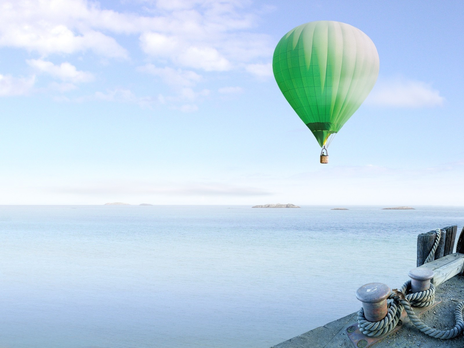 Green hot air balloon over the sea HD Wallpaper