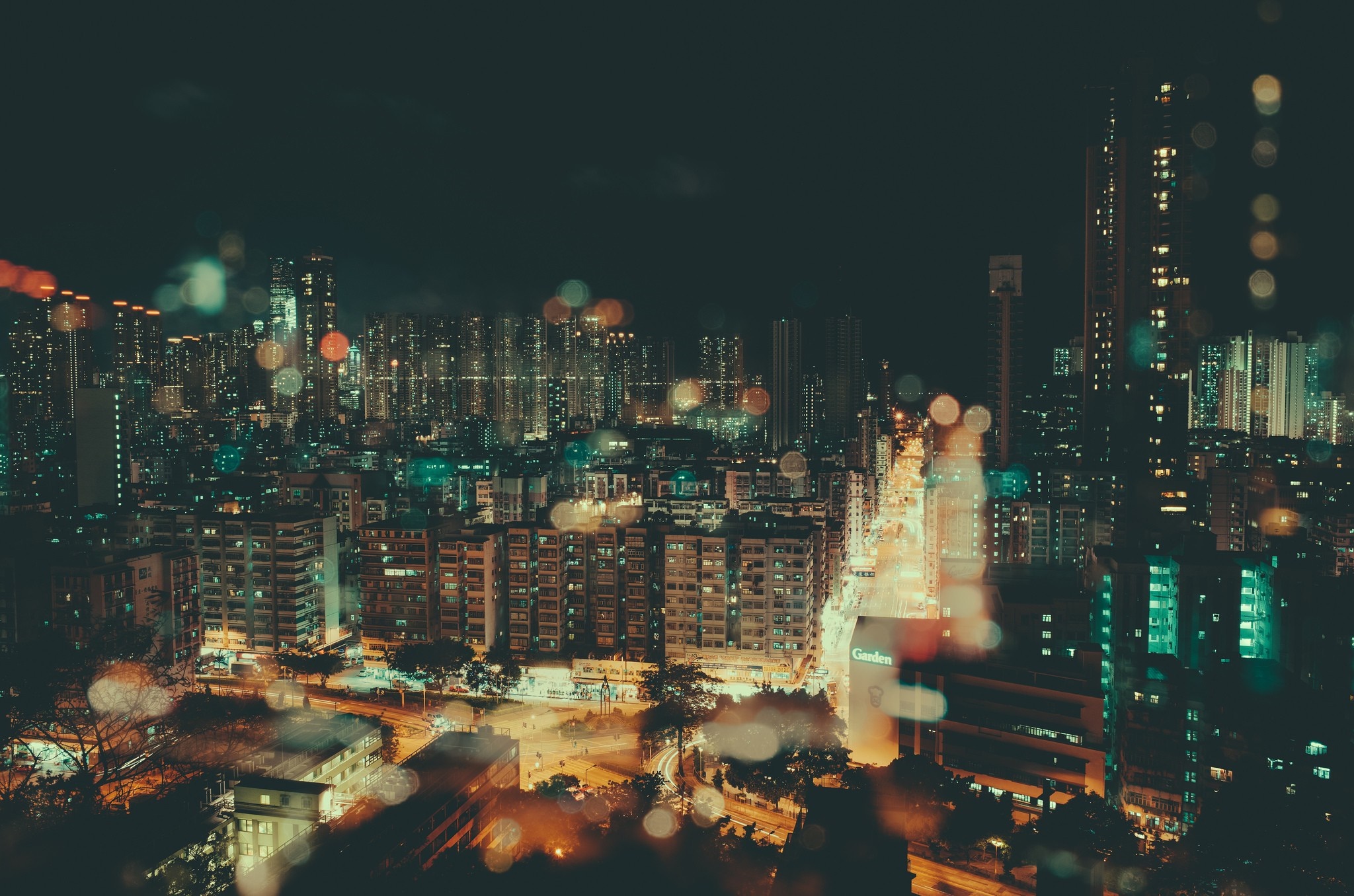 Night cityscape with bokeh lights HD Wallpaper