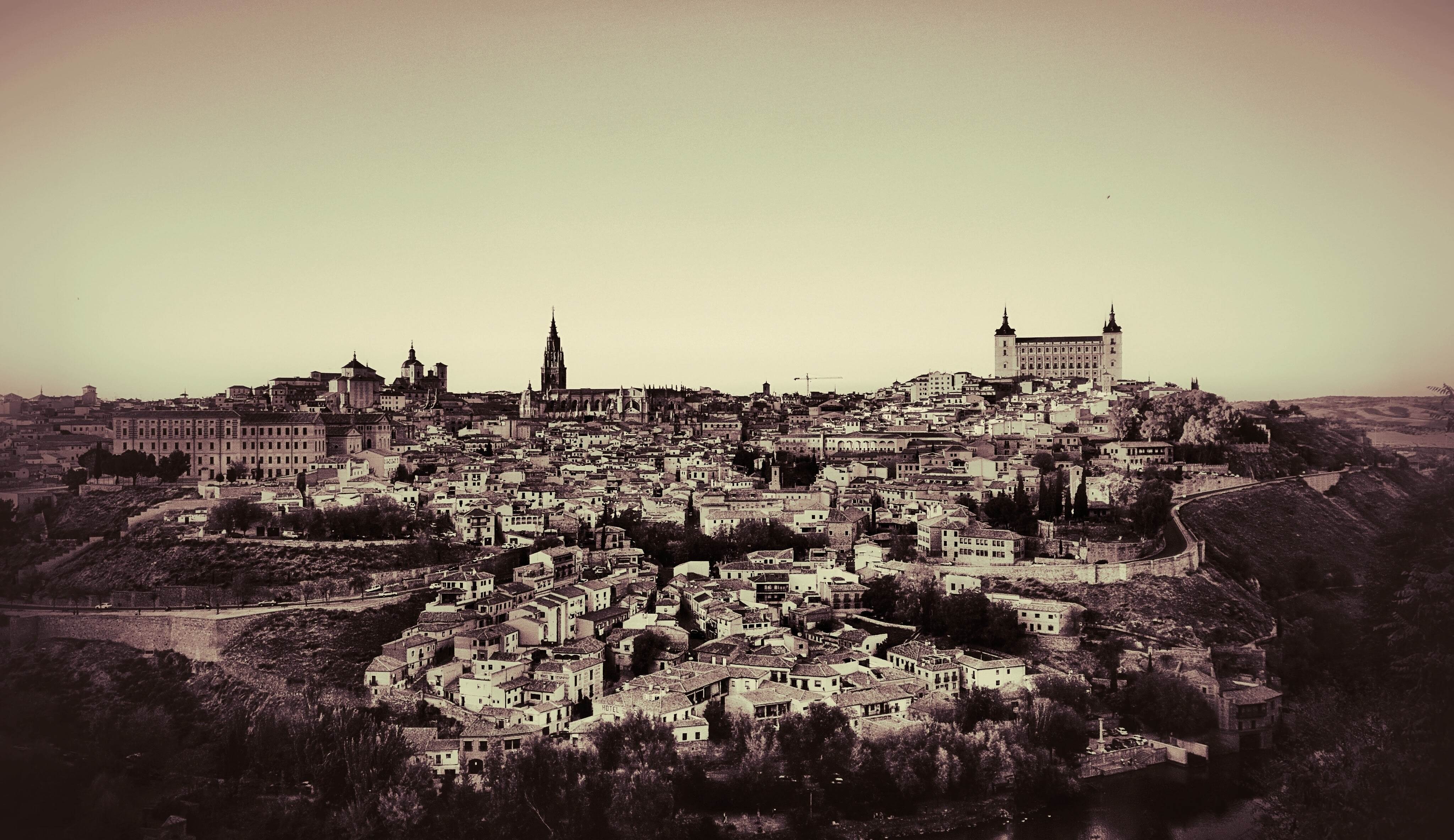 Duotone photograph of Toledo cityscape with Alcázar of Toledo HD Wallpaper