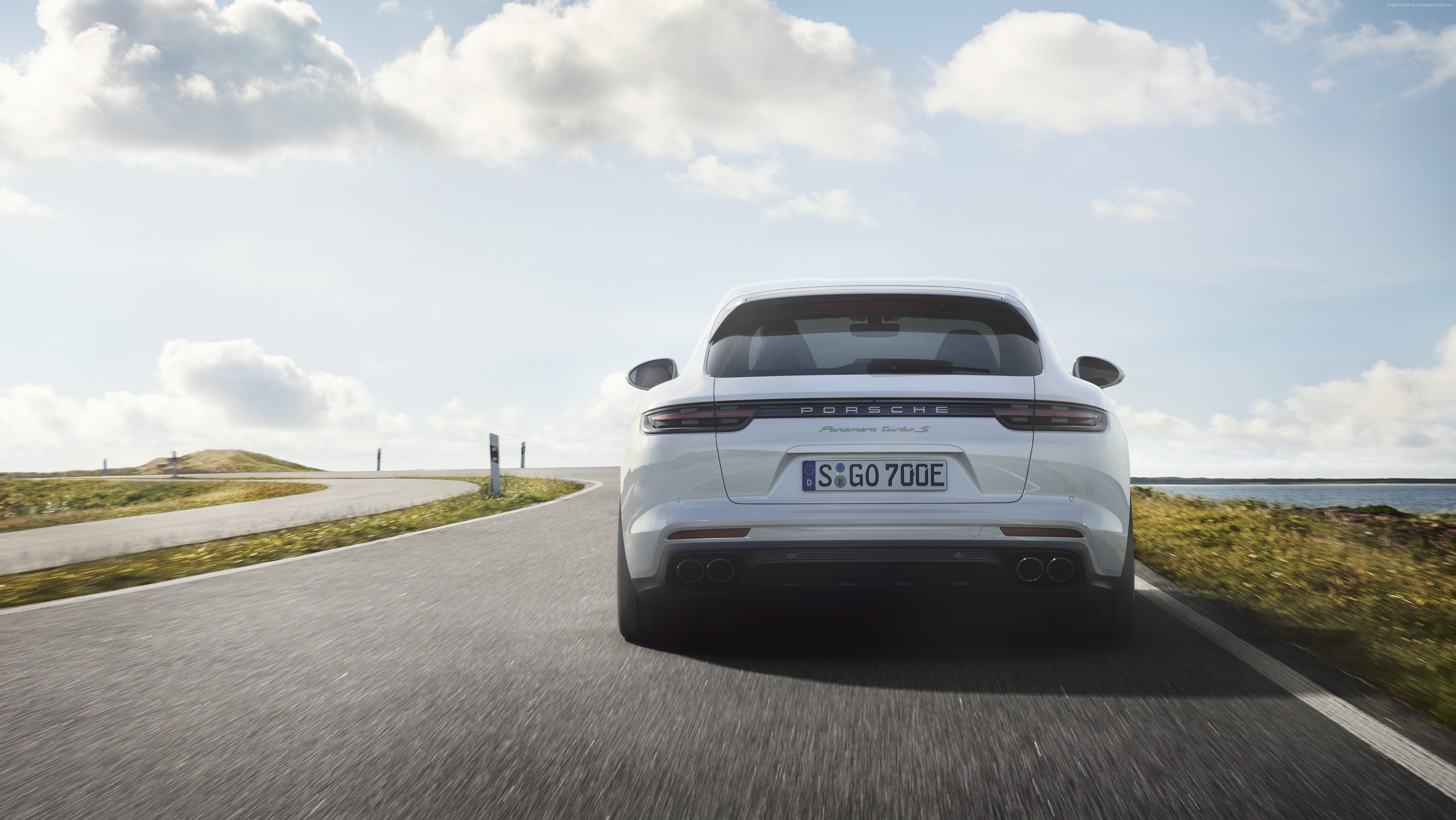 White Porsche Panamera Turbo S E-Hybrid Sport Turismo on a road HD Wallpaper