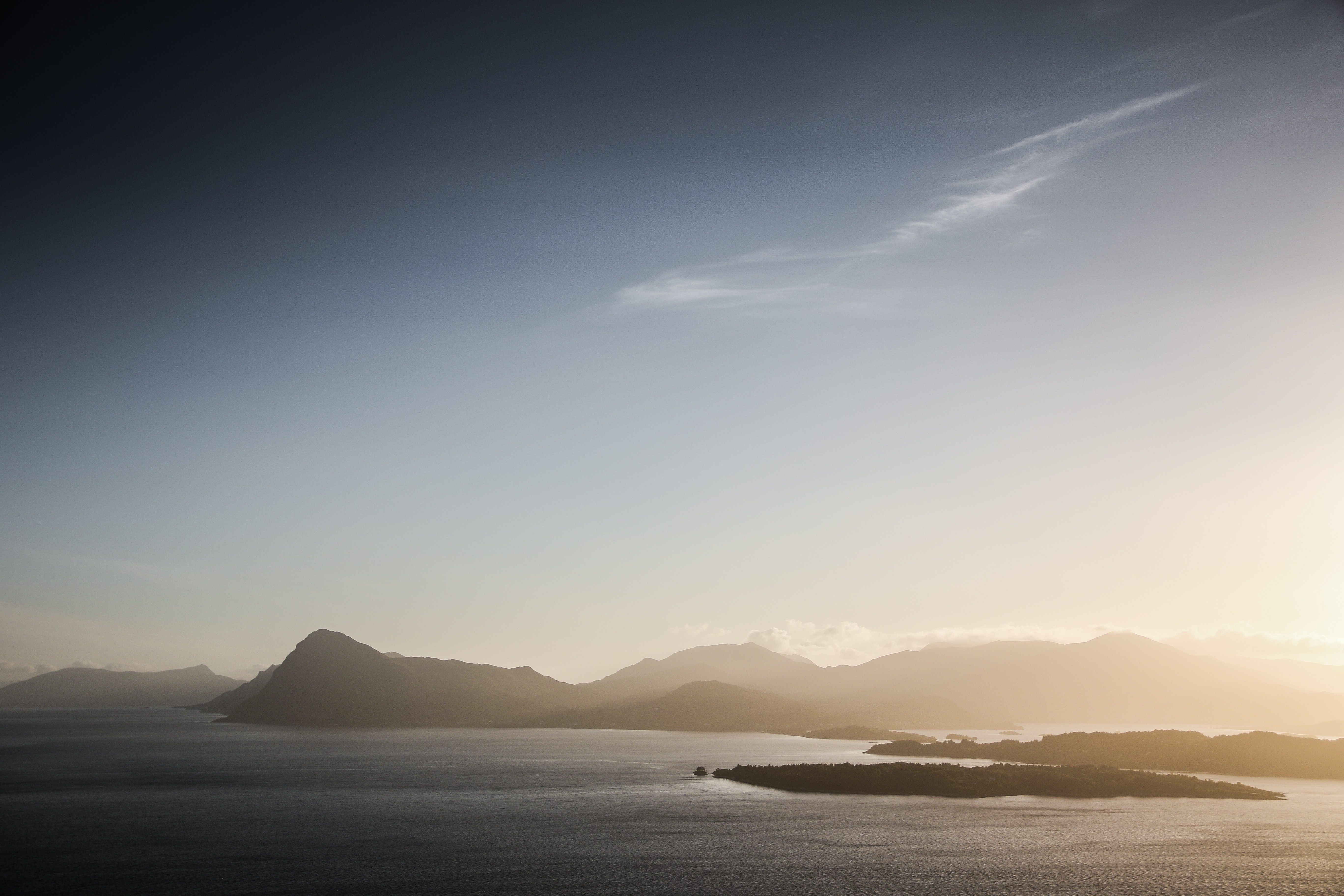 Mountains and sea at sunset HD Wallpaper