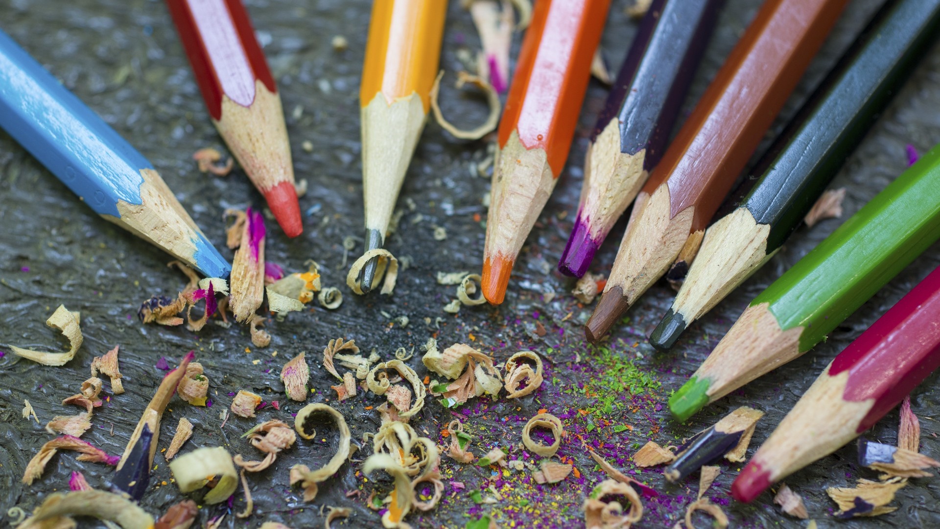 Colored pencils with shavings on a dark surface HD Wallpaper