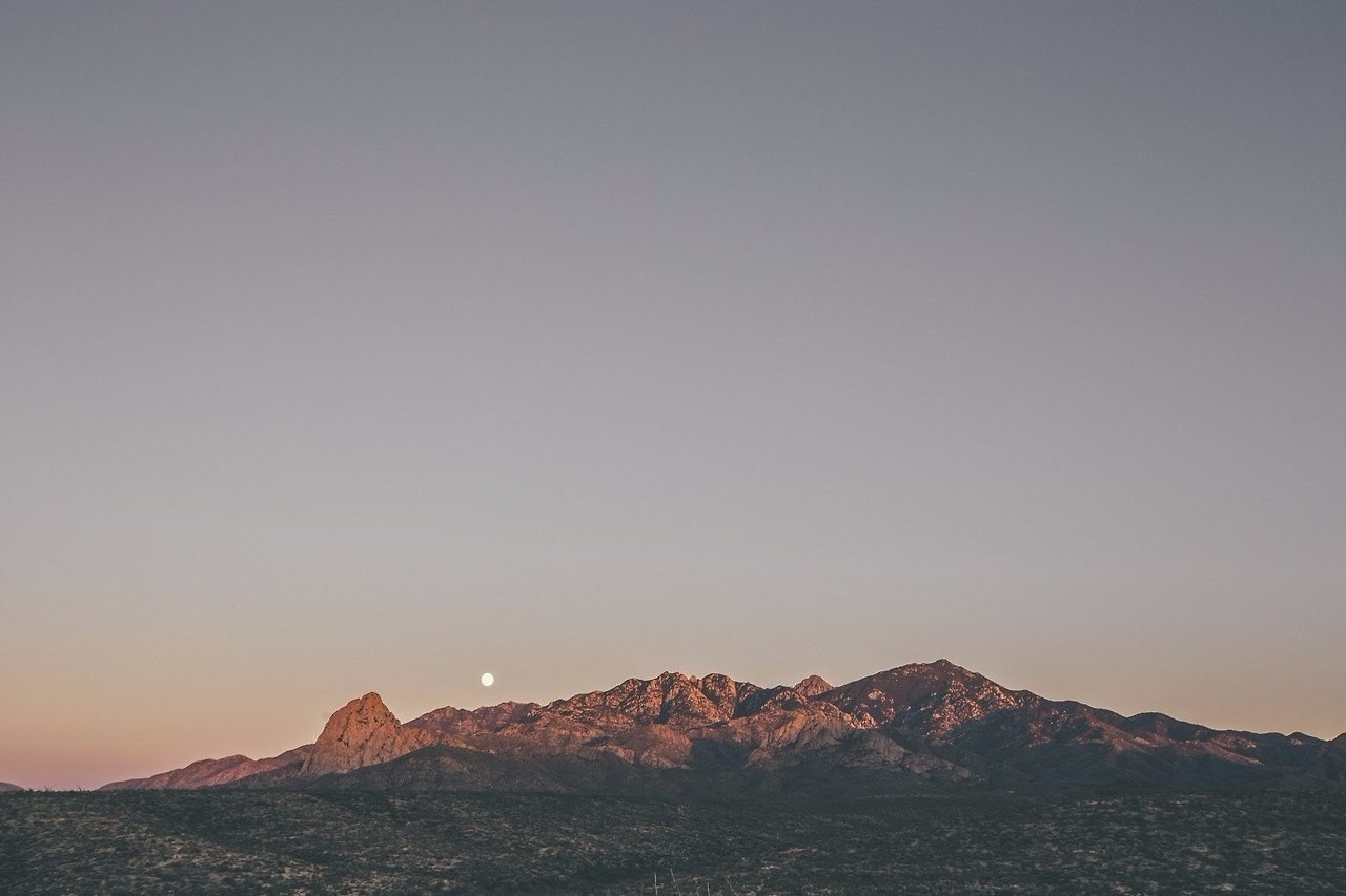 Moon over mountain range at sunset HD Wallpaper