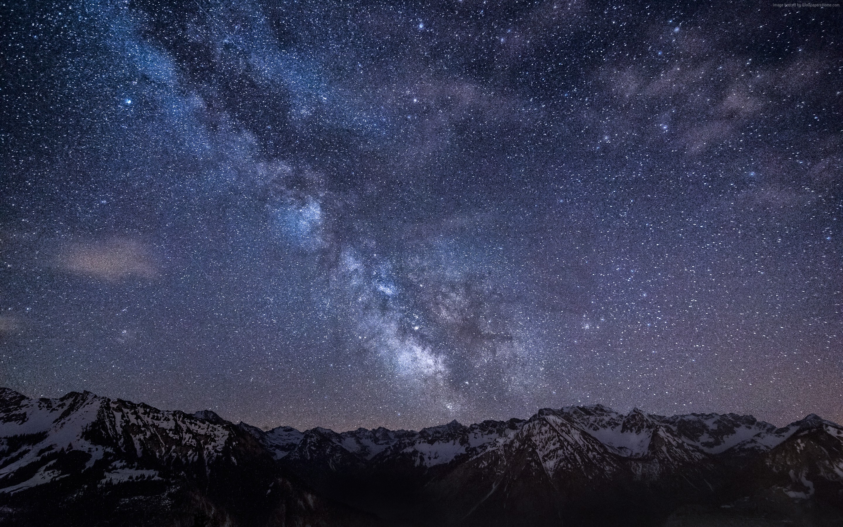 Milky Way over snow-capped mountains at night HD Wallpaper