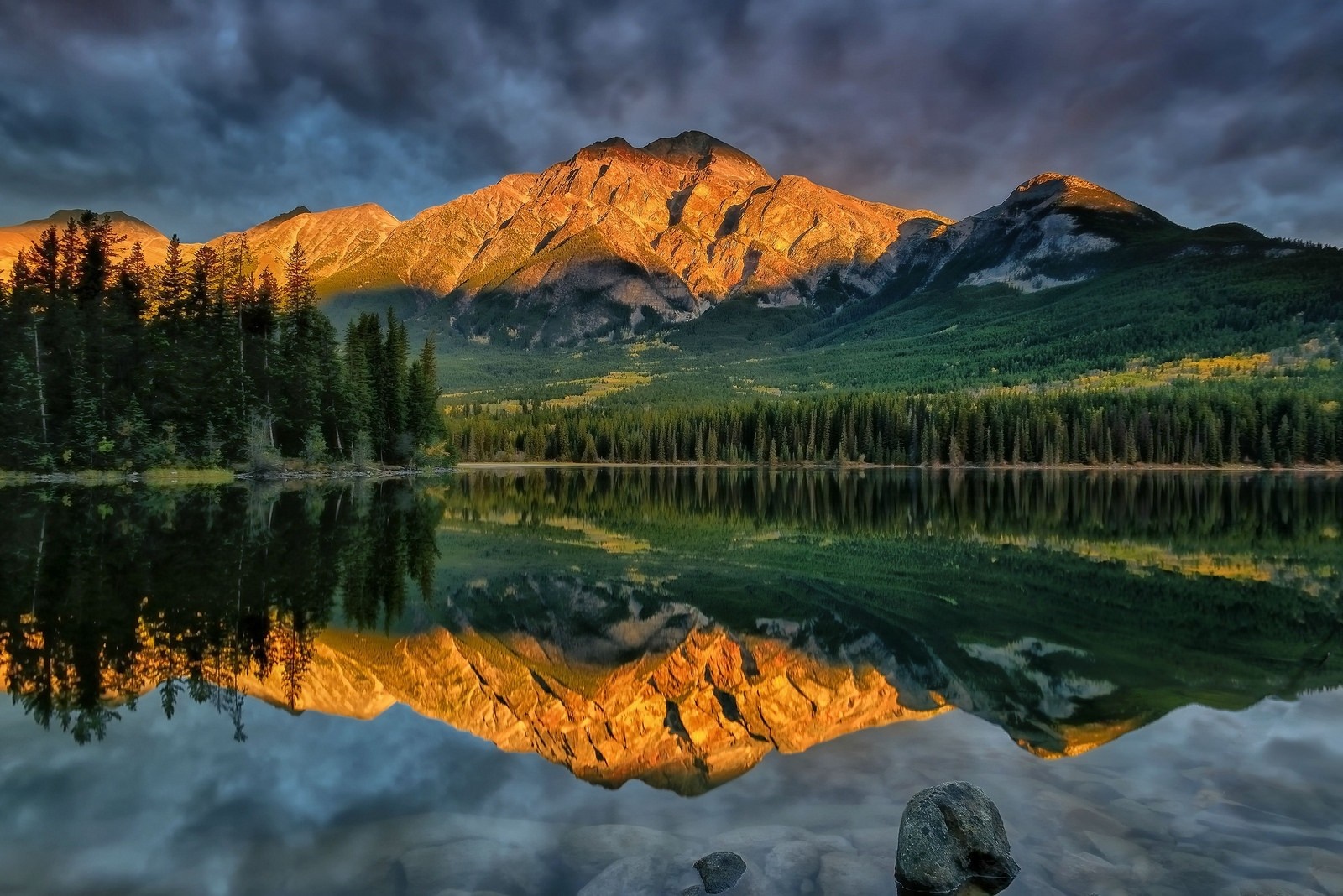 Mountain reflection in a calm lake at sunrise HD Wallpaper