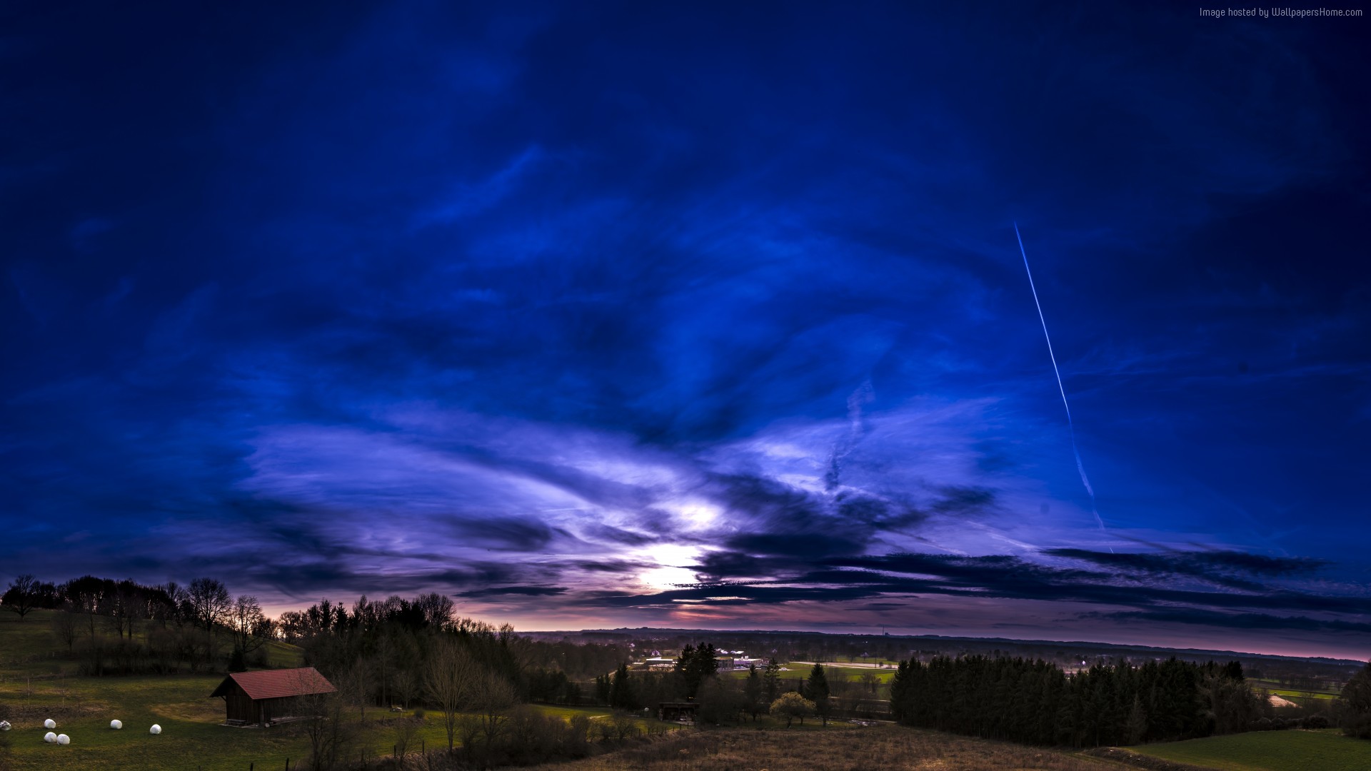 Dramatic sunset over a rural landscape with a barn HD Wallpaper