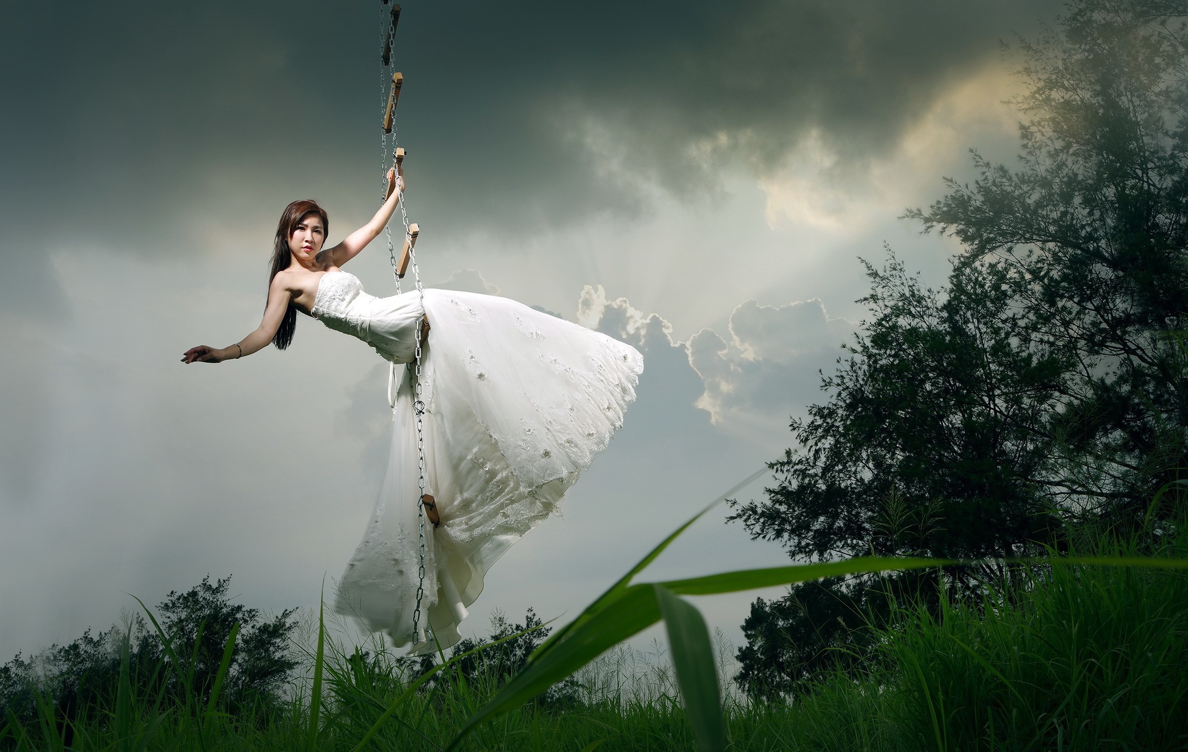 Woman in white dress climbing a rope ladder HD Wallpaper