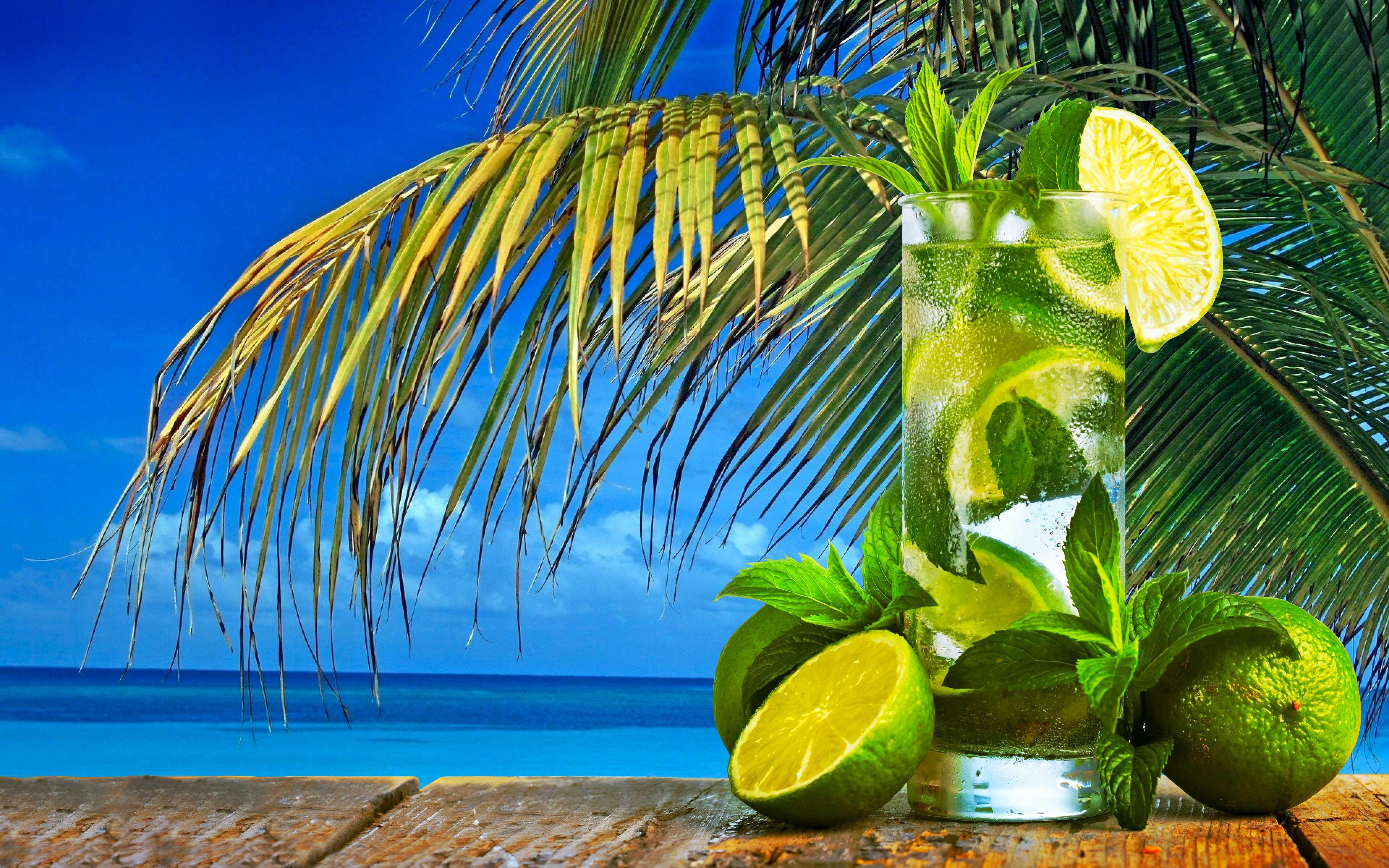 Tropical drink with limes and mint on a beach HD Wallpaper