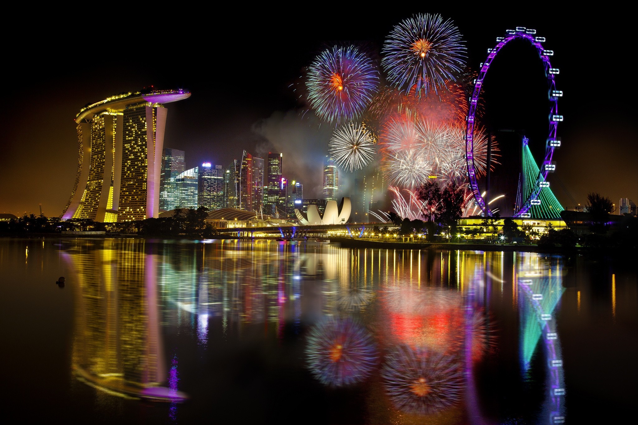 Singapore skyline with fireworks and Singapore Flyer at night HD Wallpaper