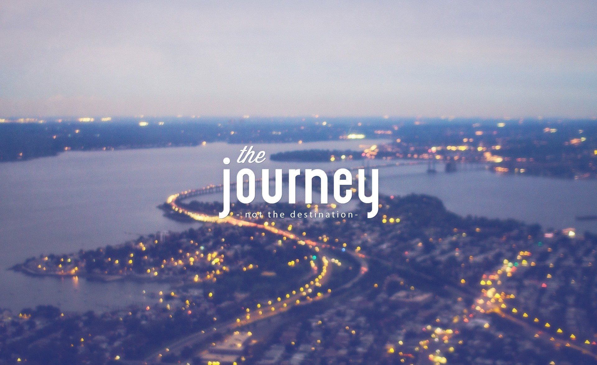 The journey not the destination quote over cityscape at dusk HD Wallpaper
