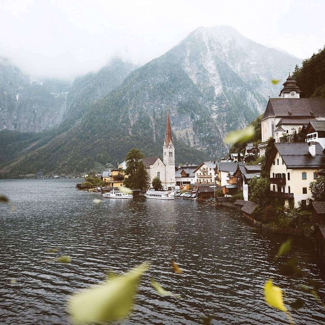Hallstatt village with church and mountains HD Wallpaper