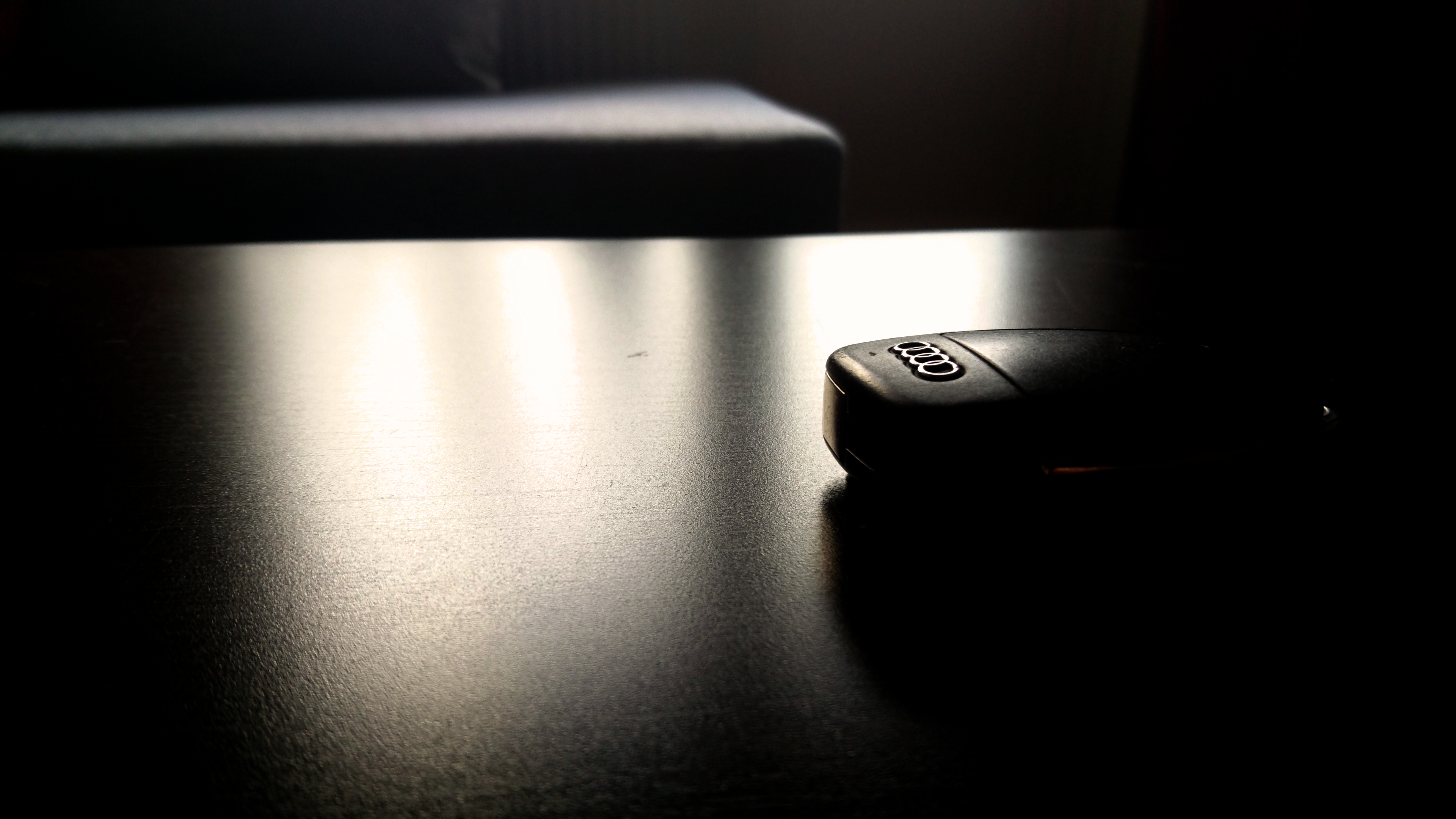 Audi car key on a dark table HD Wallpaper