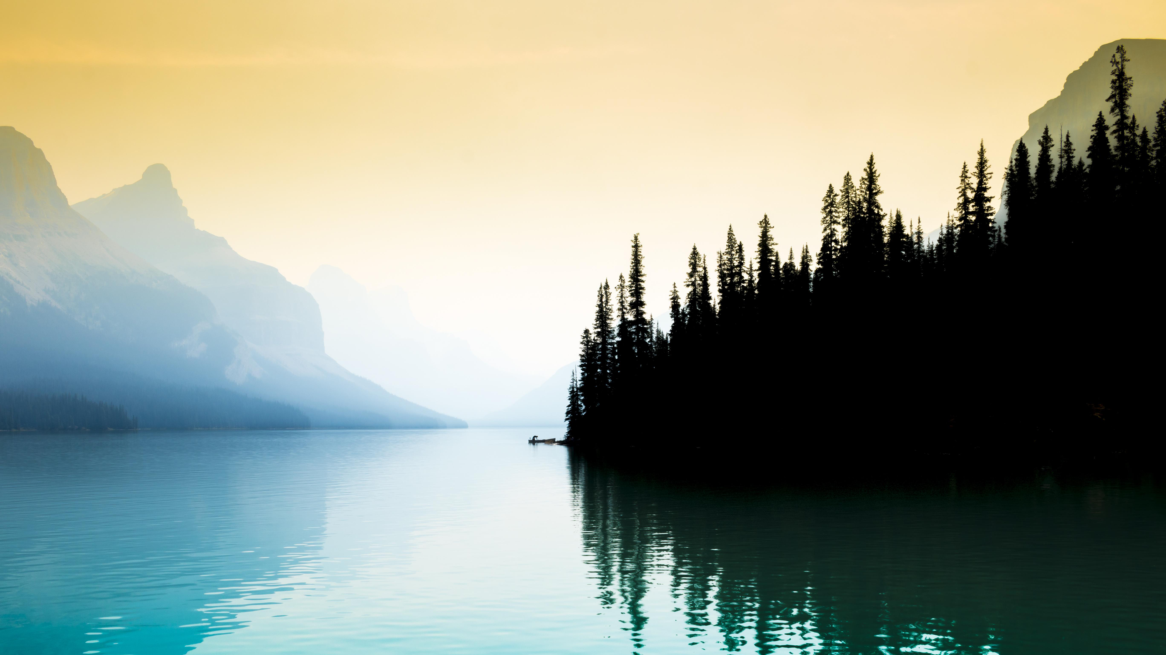 Serene Morning at Lake Maligne with Misty Mountains HD Wallpaper