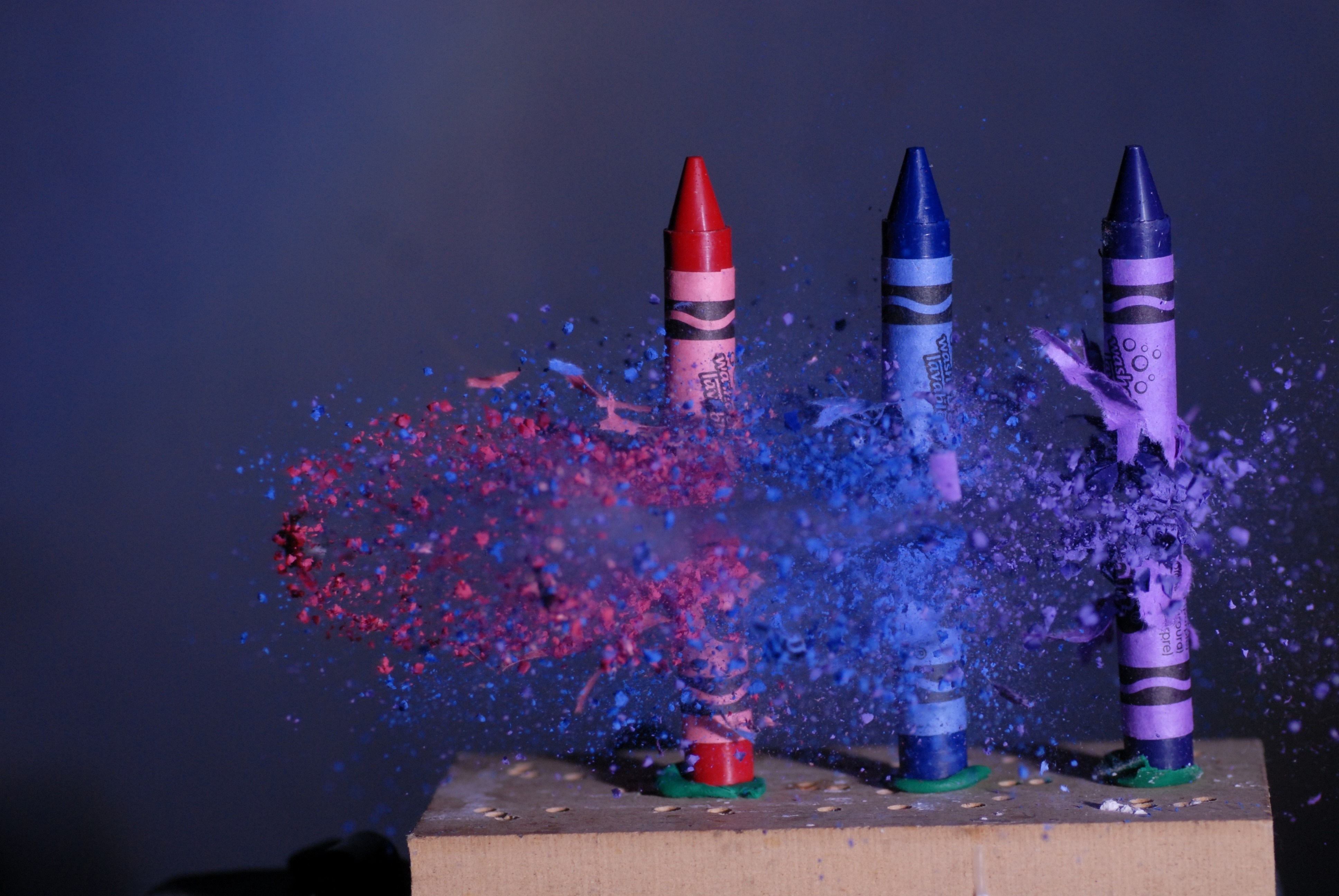 Exploding crayons with colorful powder HD Wallpaper