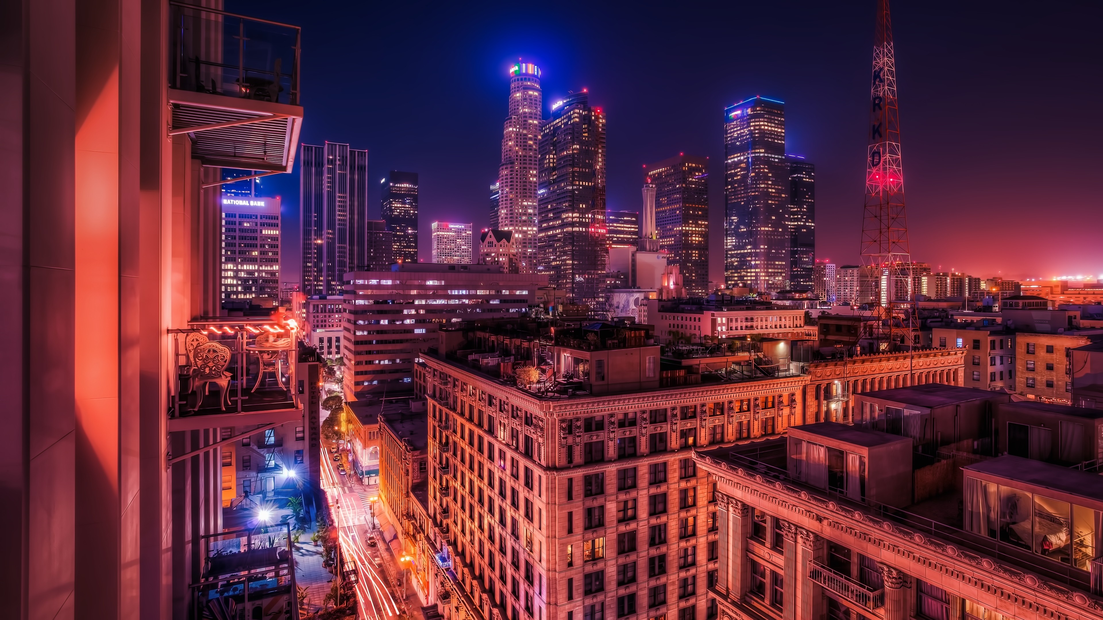 Downtown Los Angeles cityscape at night with skyscrapers and a radio tower HD Wallpaper