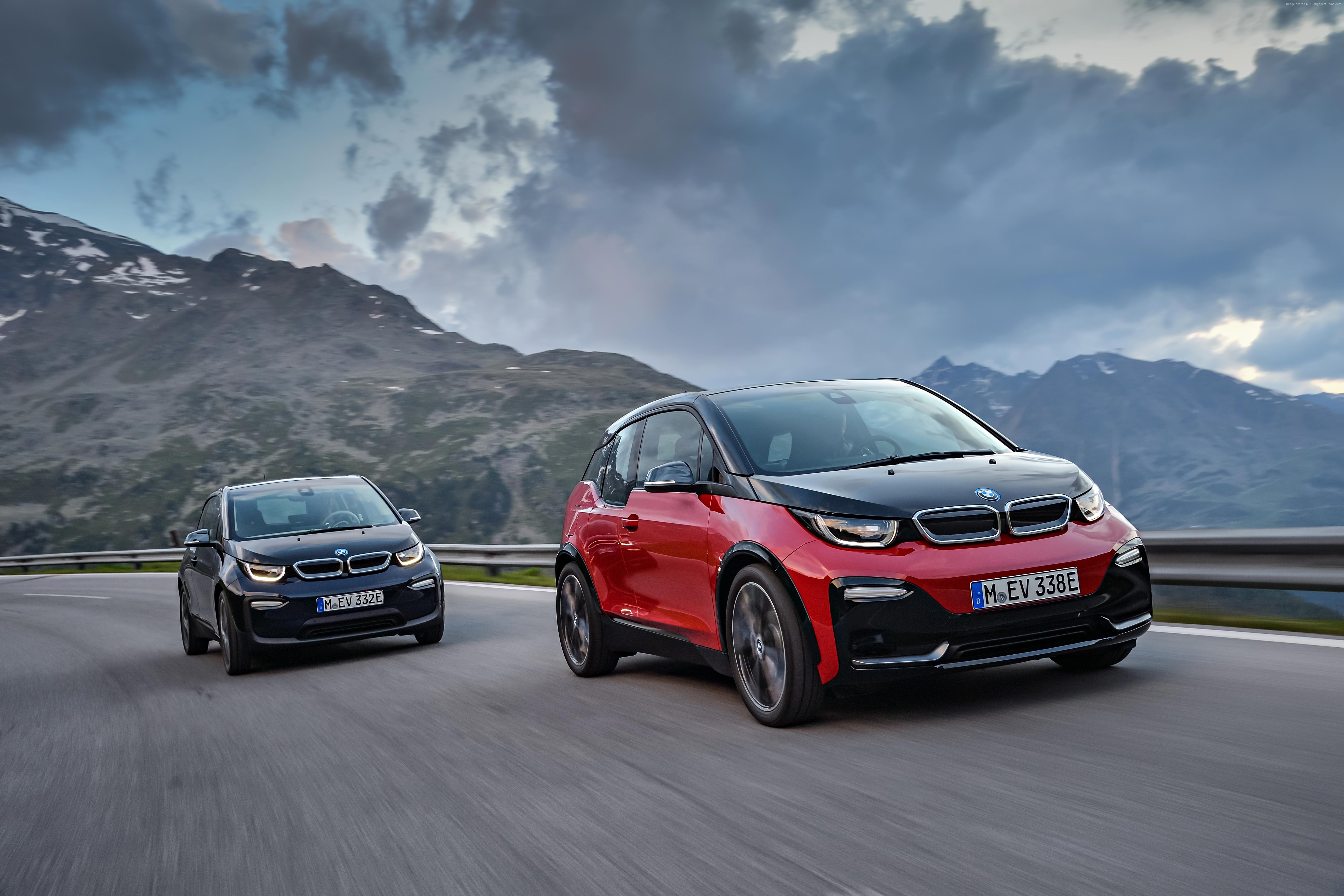 Two BMW i3s electric cars on a mountain road HD Wallpaper