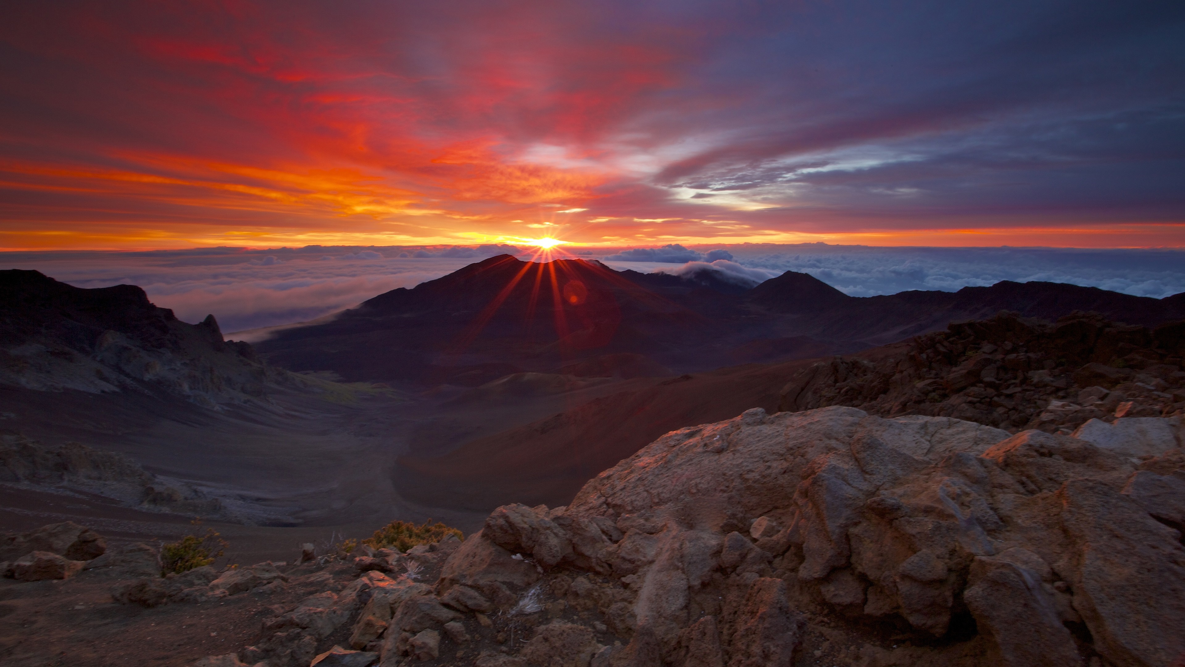 Sunrise over mountains above clouds HD Wallpaper