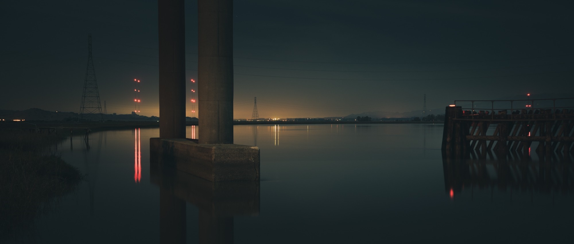 Night landscape with bridge pillars and water reflection HD Wallpaper
