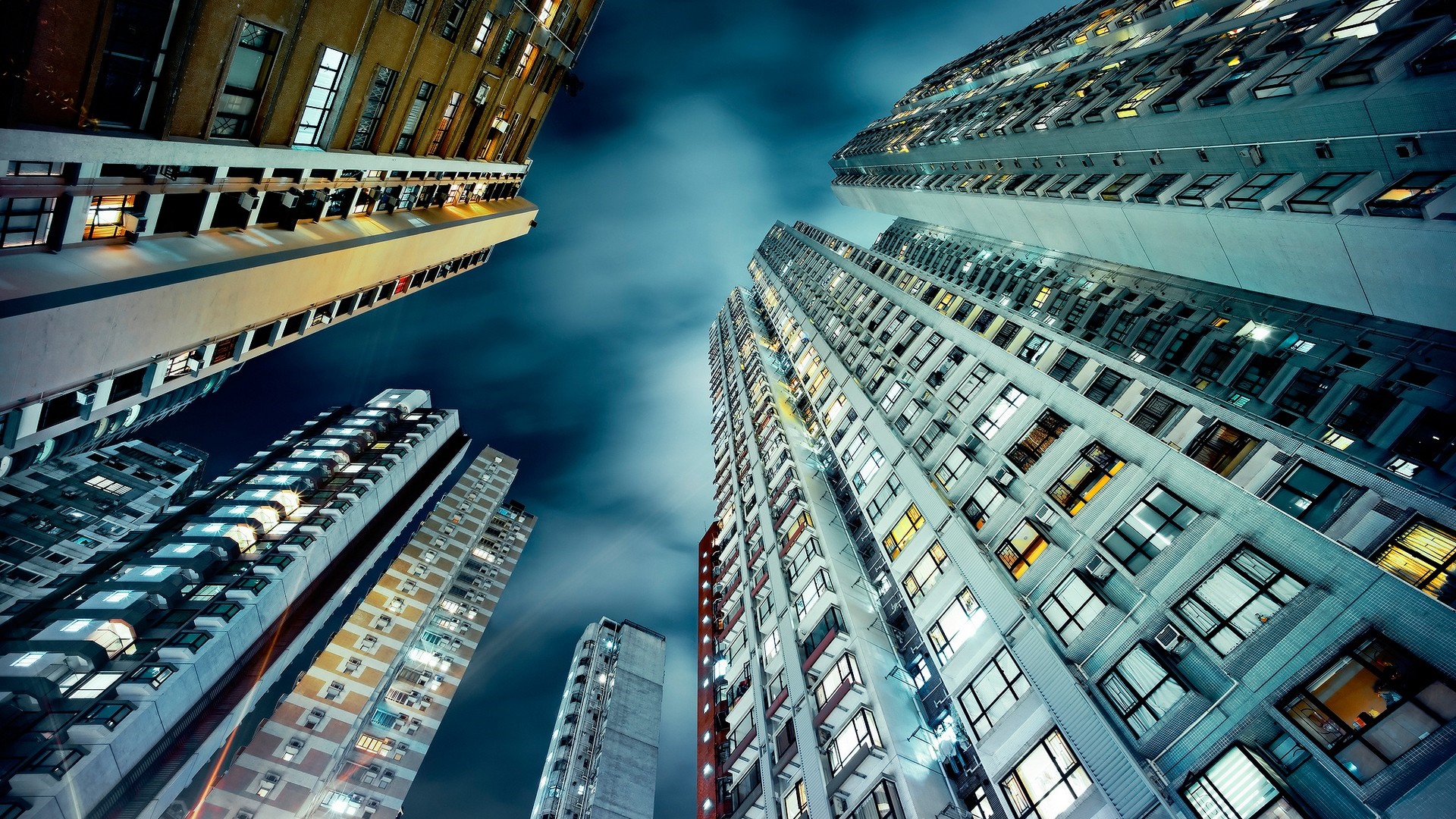 Skyscrapers at night with clouds HD Wallpaper