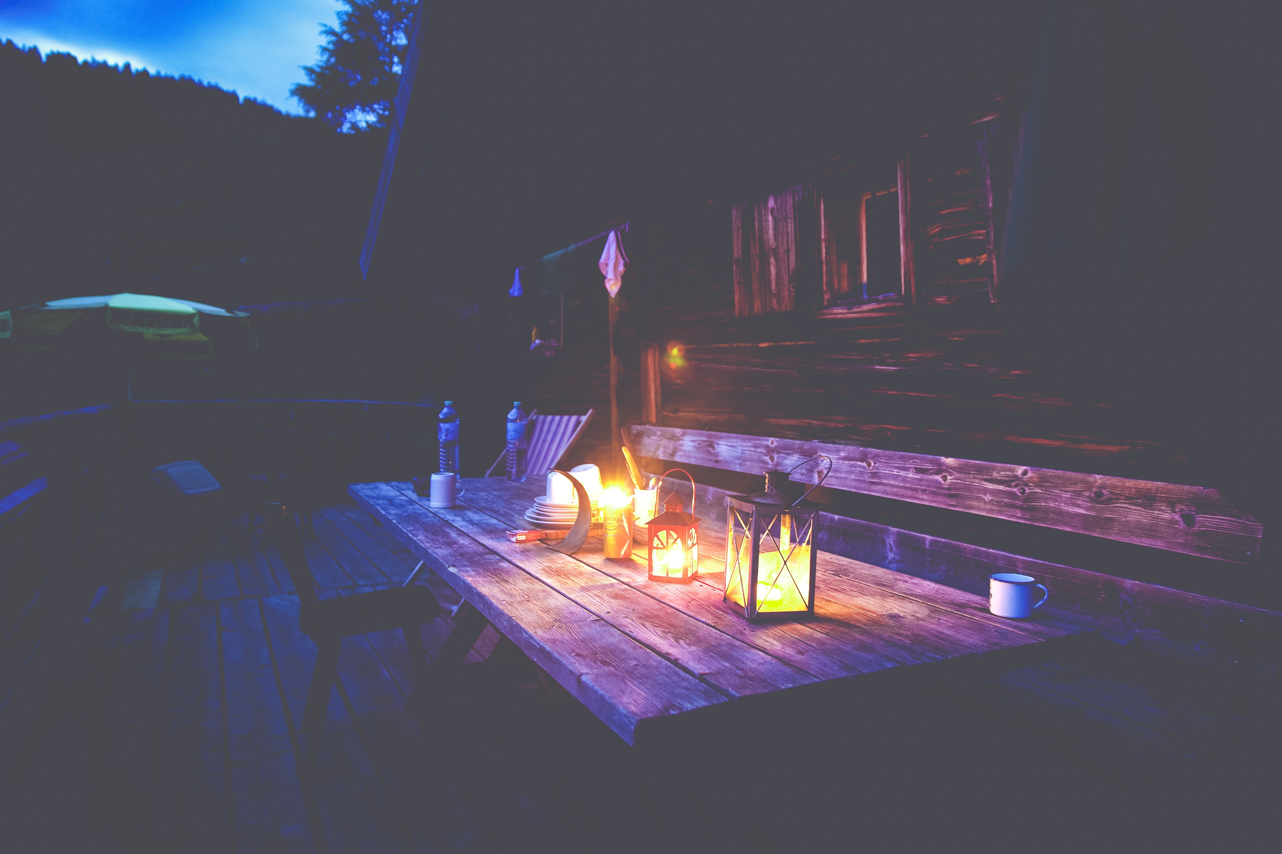 Lanterns on a wooden table at night HD Wallpaper