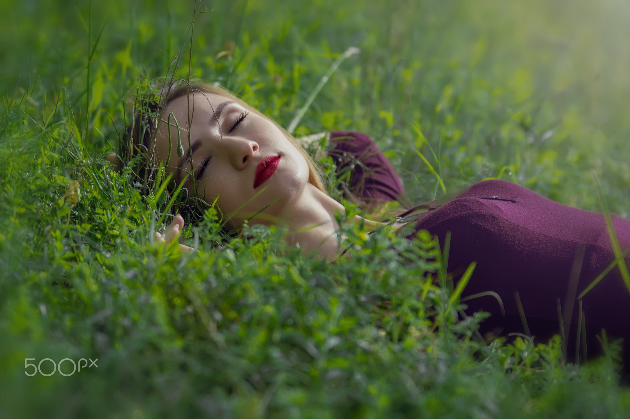 Woman lying in grass with closed eyes HD Wallpaper