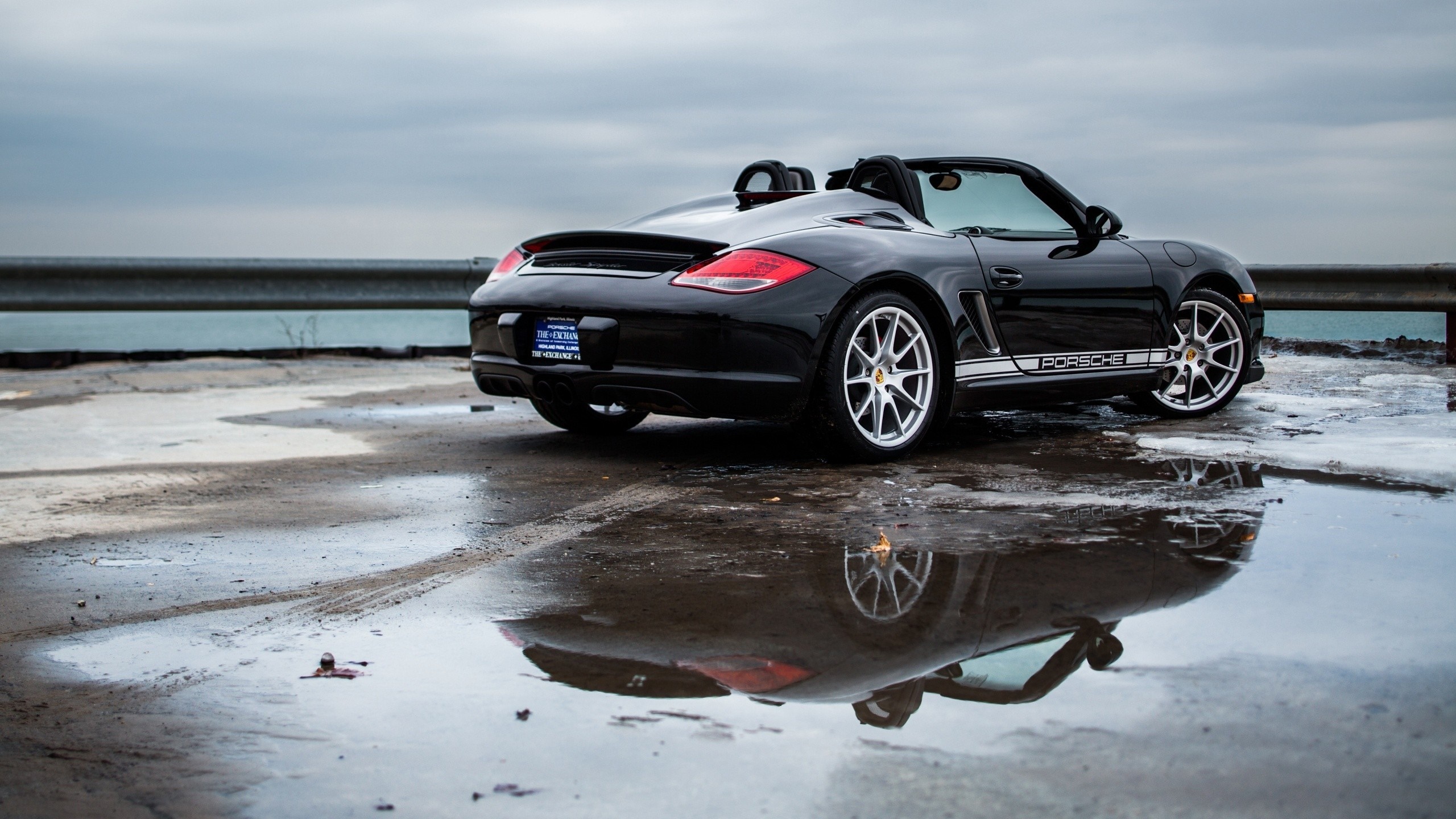 Black Porsche Boxster Convertible on Wet Surface HD Wallpaper