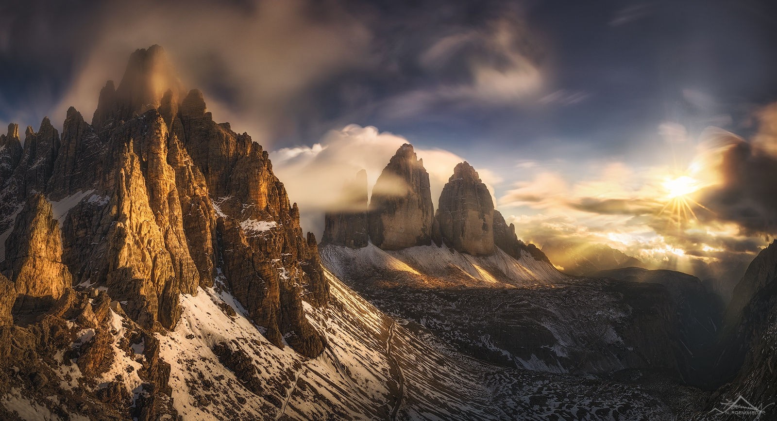 Tre Cime di Lavaredo mountains at sunrise with sun rays HD Wallpaper