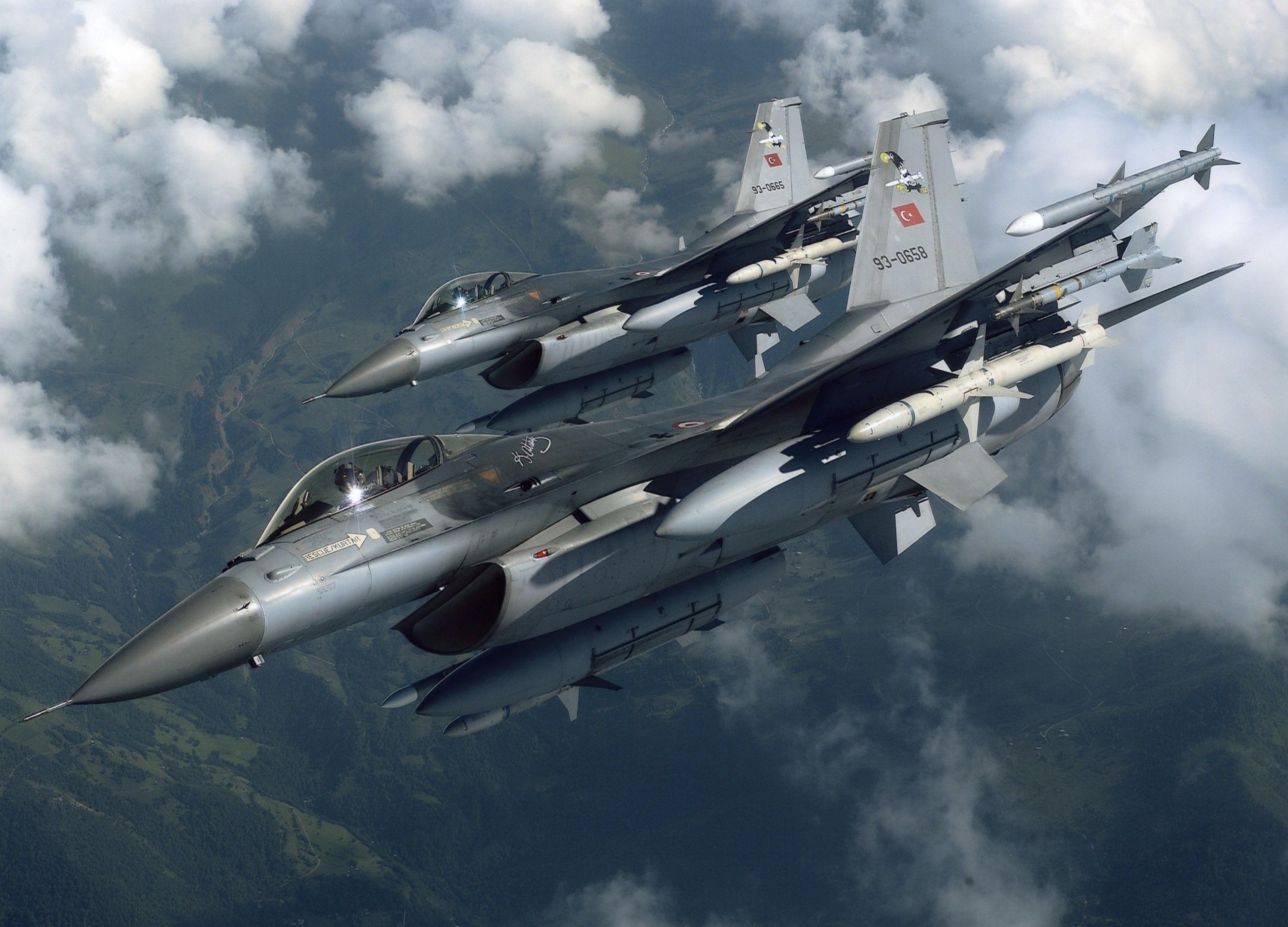 Two Turkish Air Force F-16 fighter jets in flight HD Wallpaper