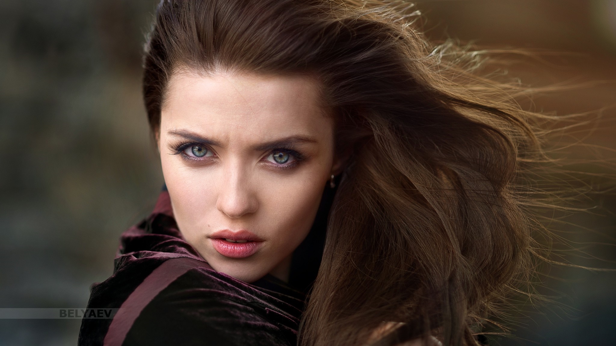 Portrait of a woman with flowing brown hair HD Wallpaper