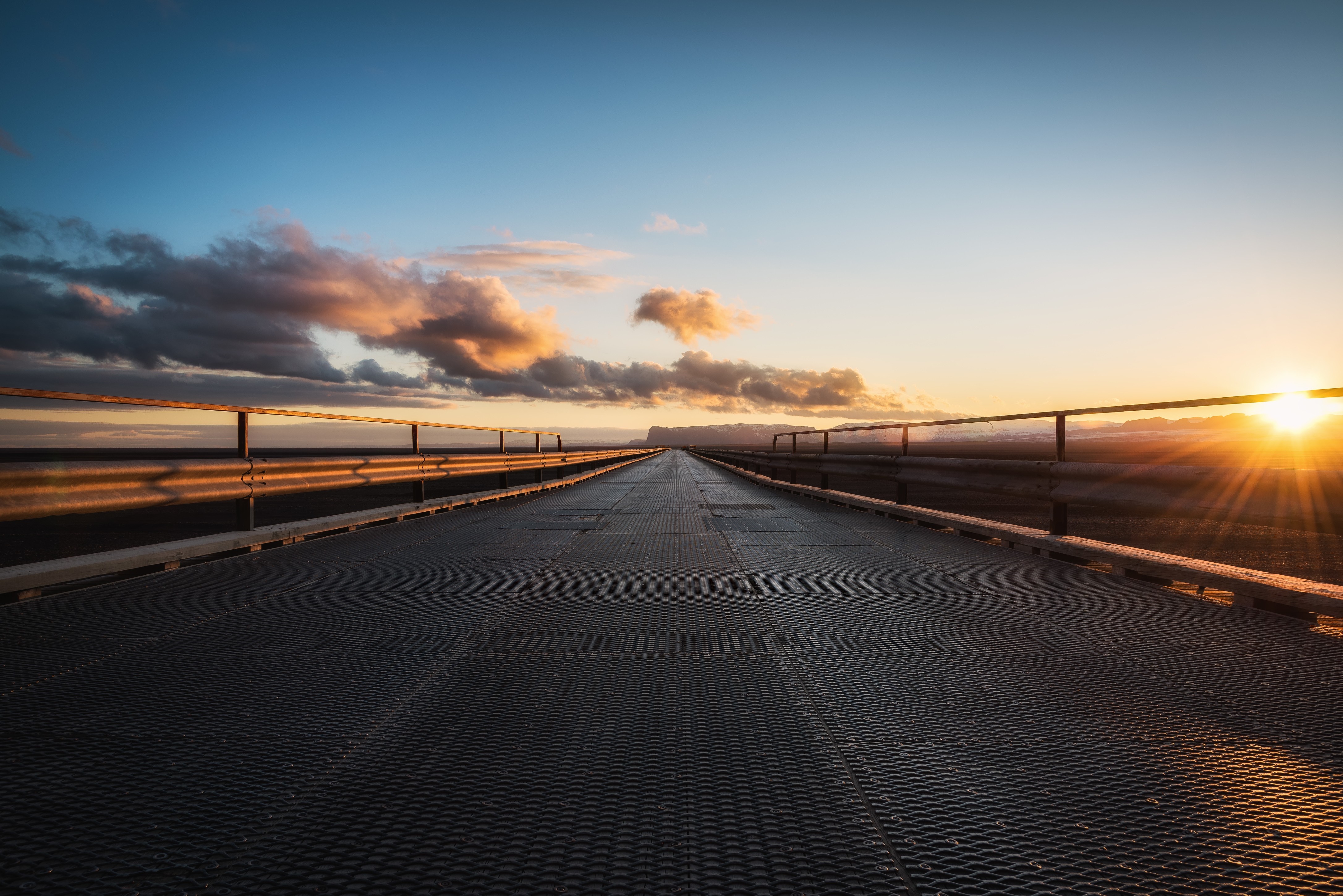 Bridge at sunset with sun rays HD Wallpaper