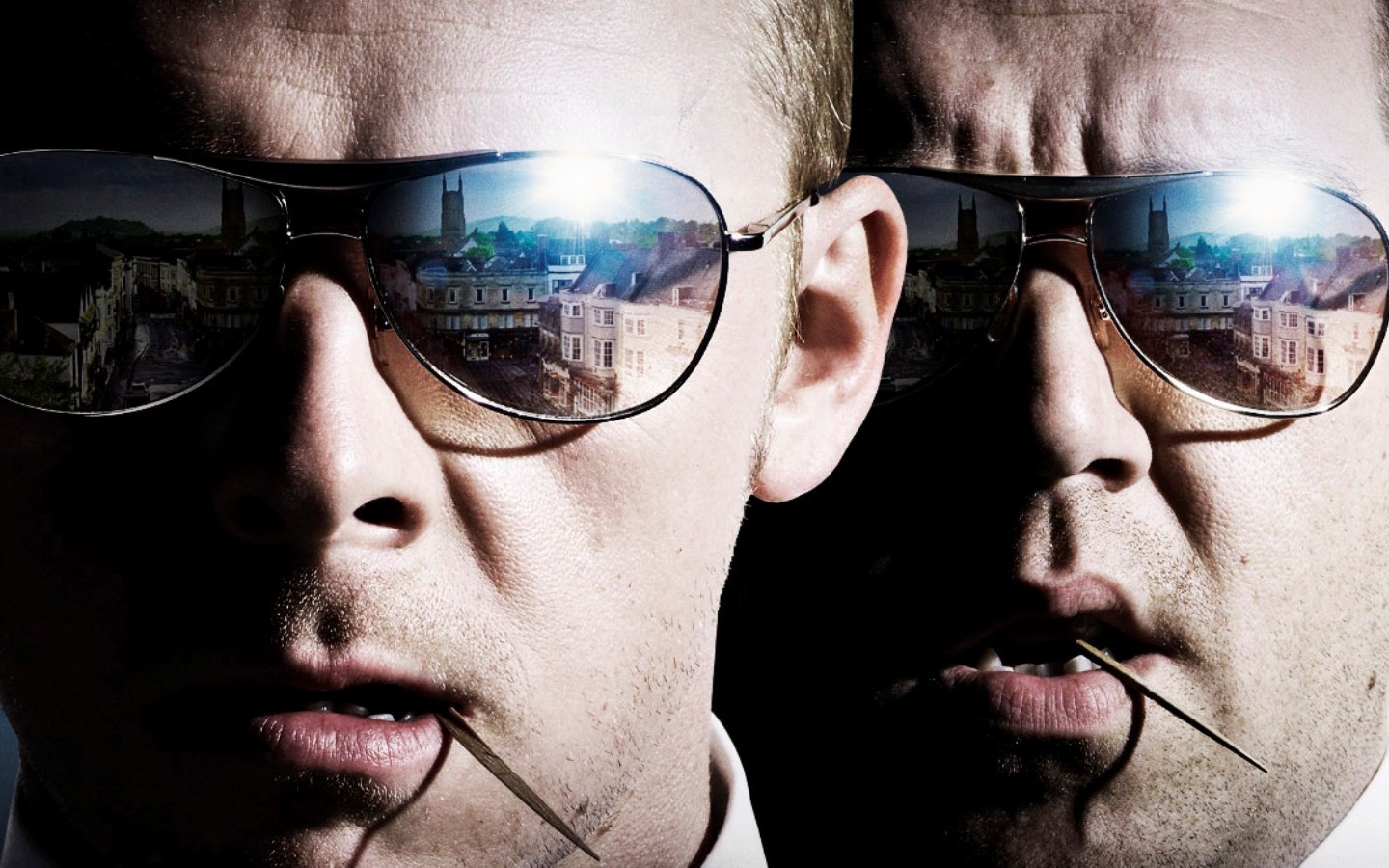 Two men wearing sunglasses with reflections of a town HD Wallpaper