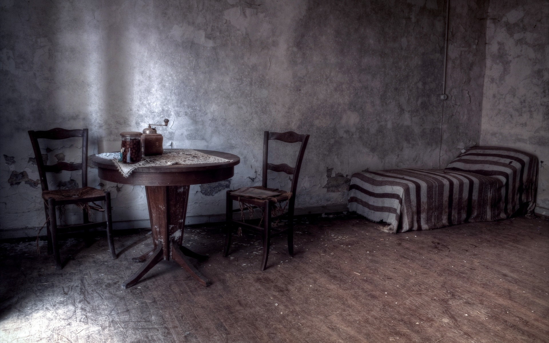 Abandoned room with bed, table, and chairs HD Wallpaper