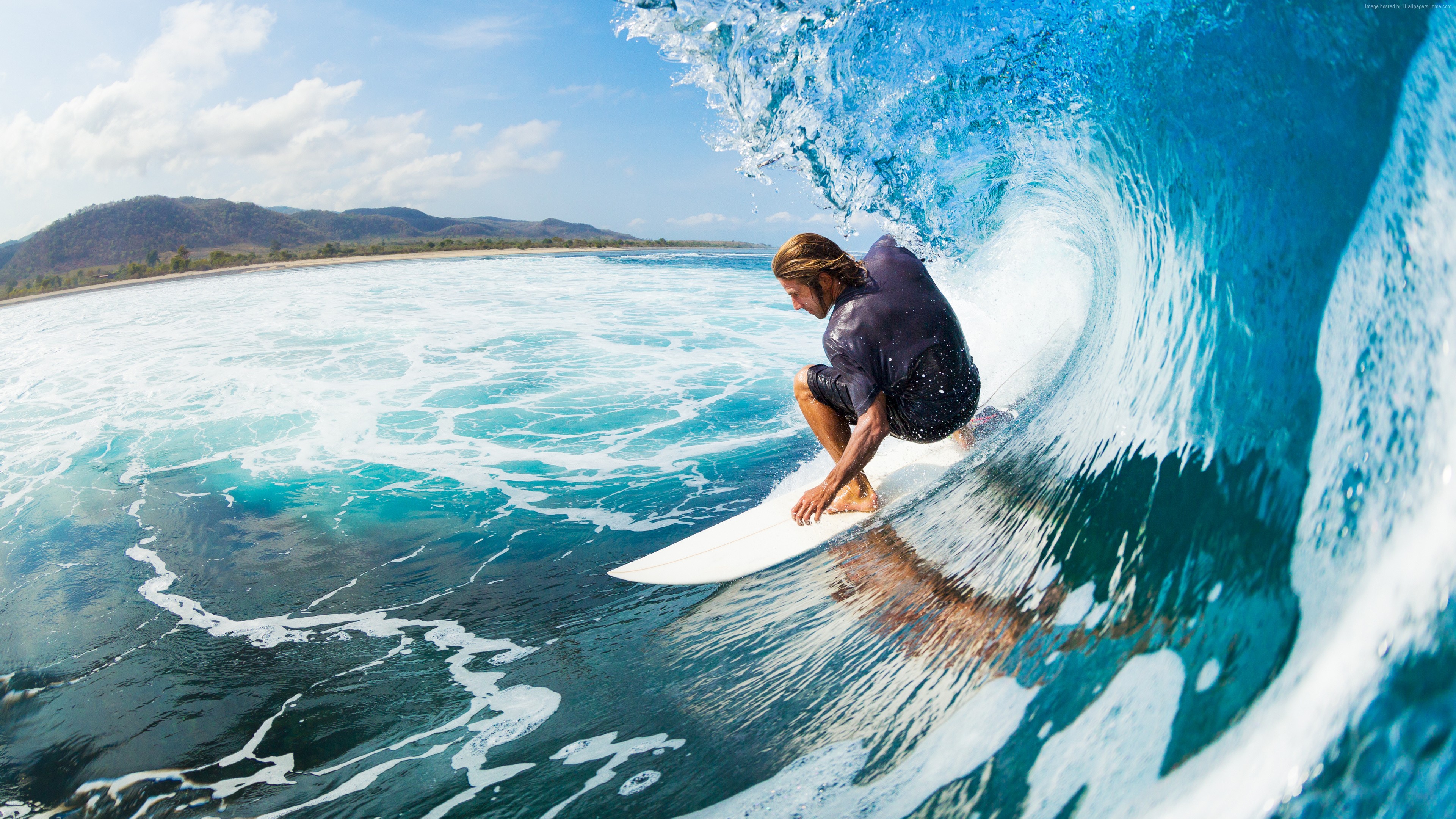 Surfer riding a wave in the ocean HD Wallpaper