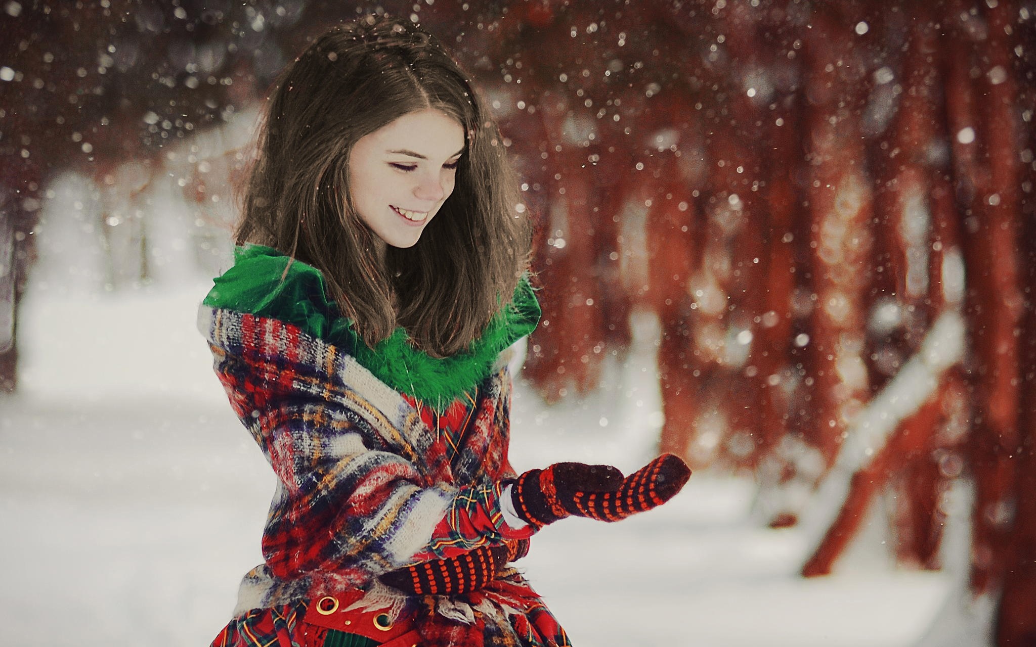 Girl in winter coat with snow falling HD Wallpaper