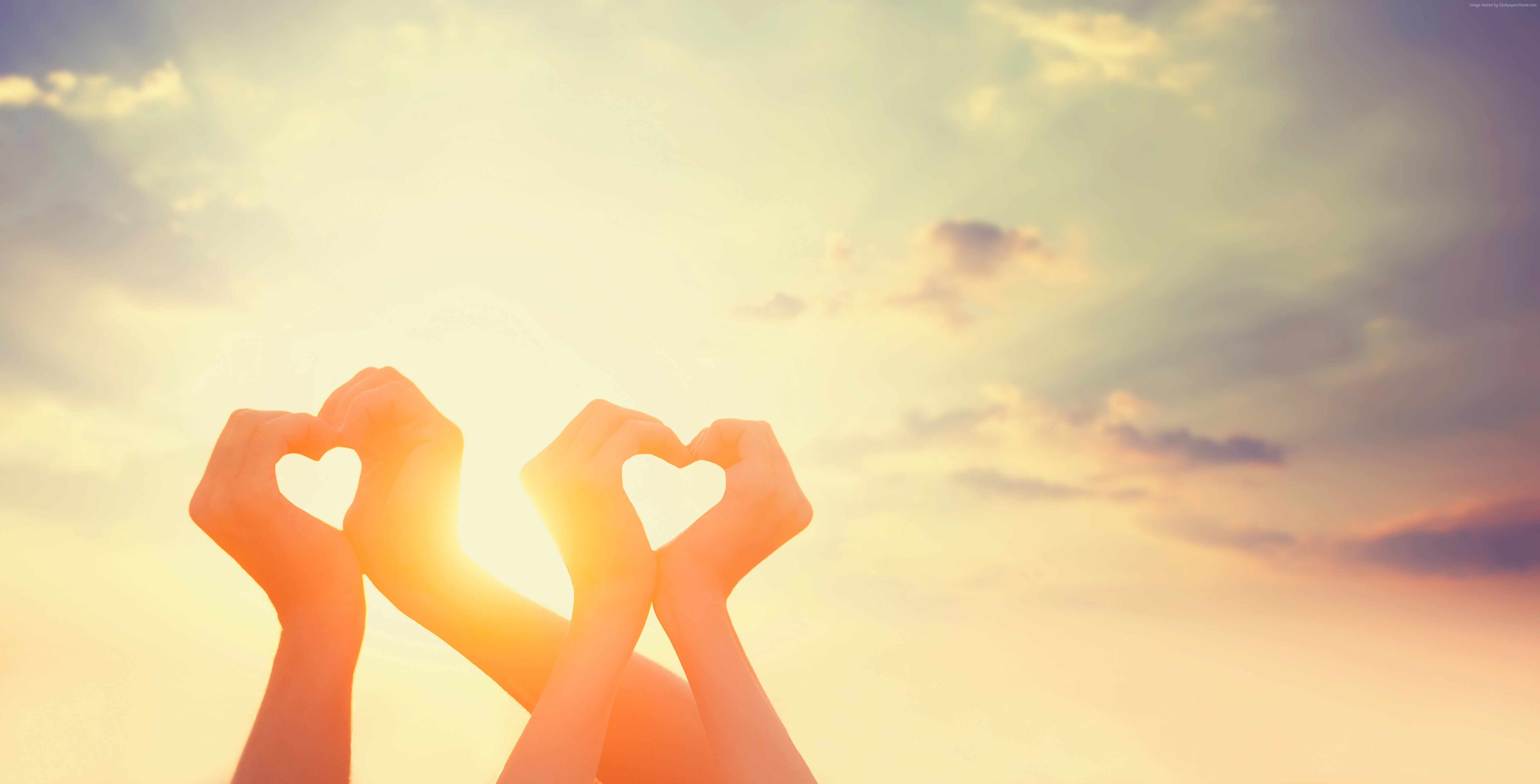 Hands forming a heart shape against the sunset HD Wallpaper