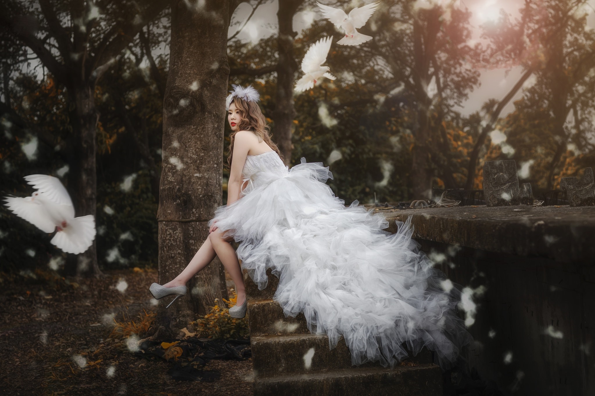 Woman in white dress with doves in forest HD Wallpaper