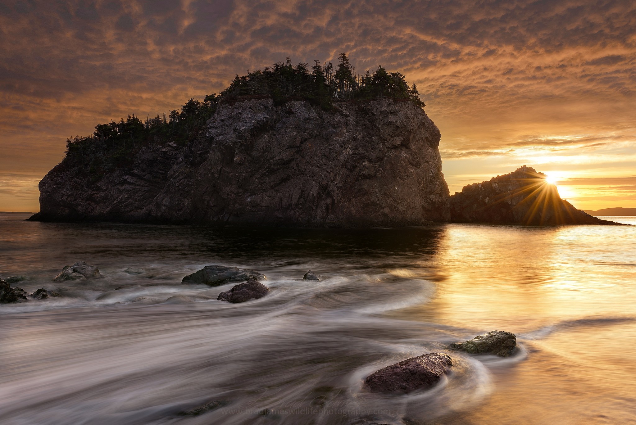 Sunset over rocky coast with waves crashing HD Wallpaper
