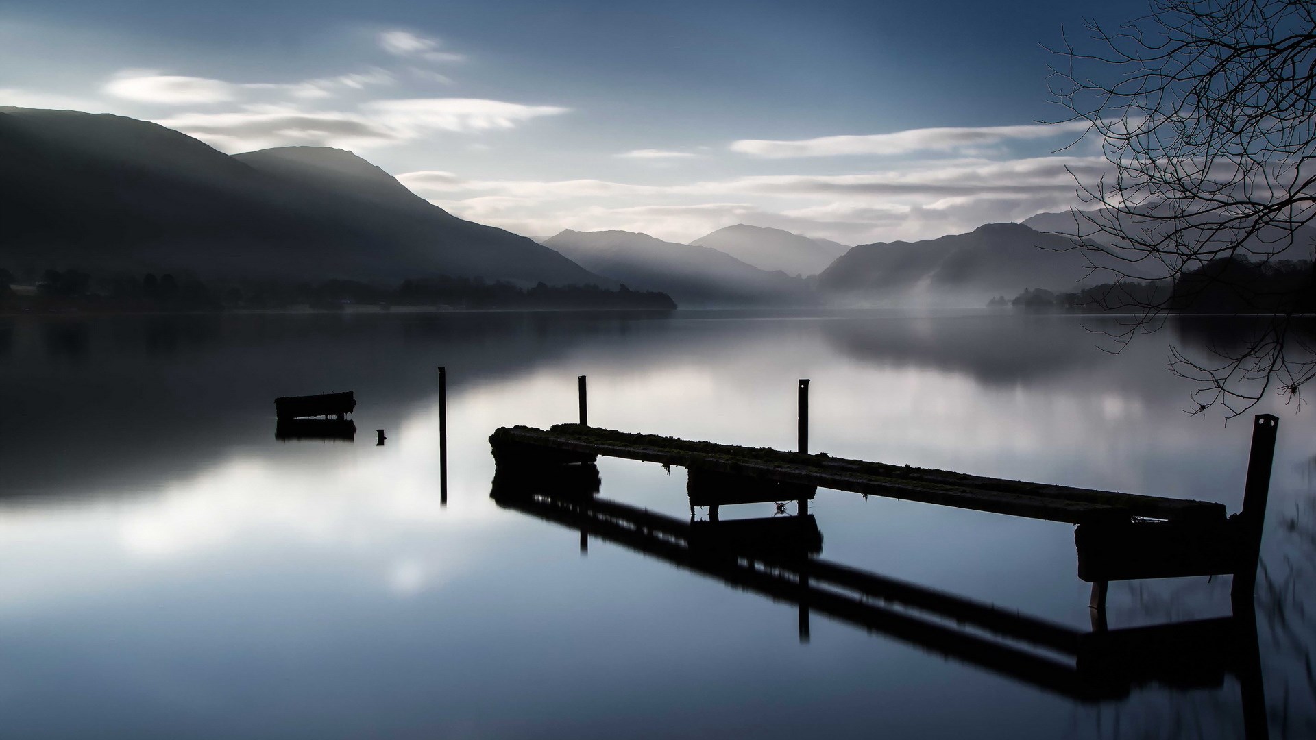 Misty lake with a wooden pier and mountains HD Wallpaper