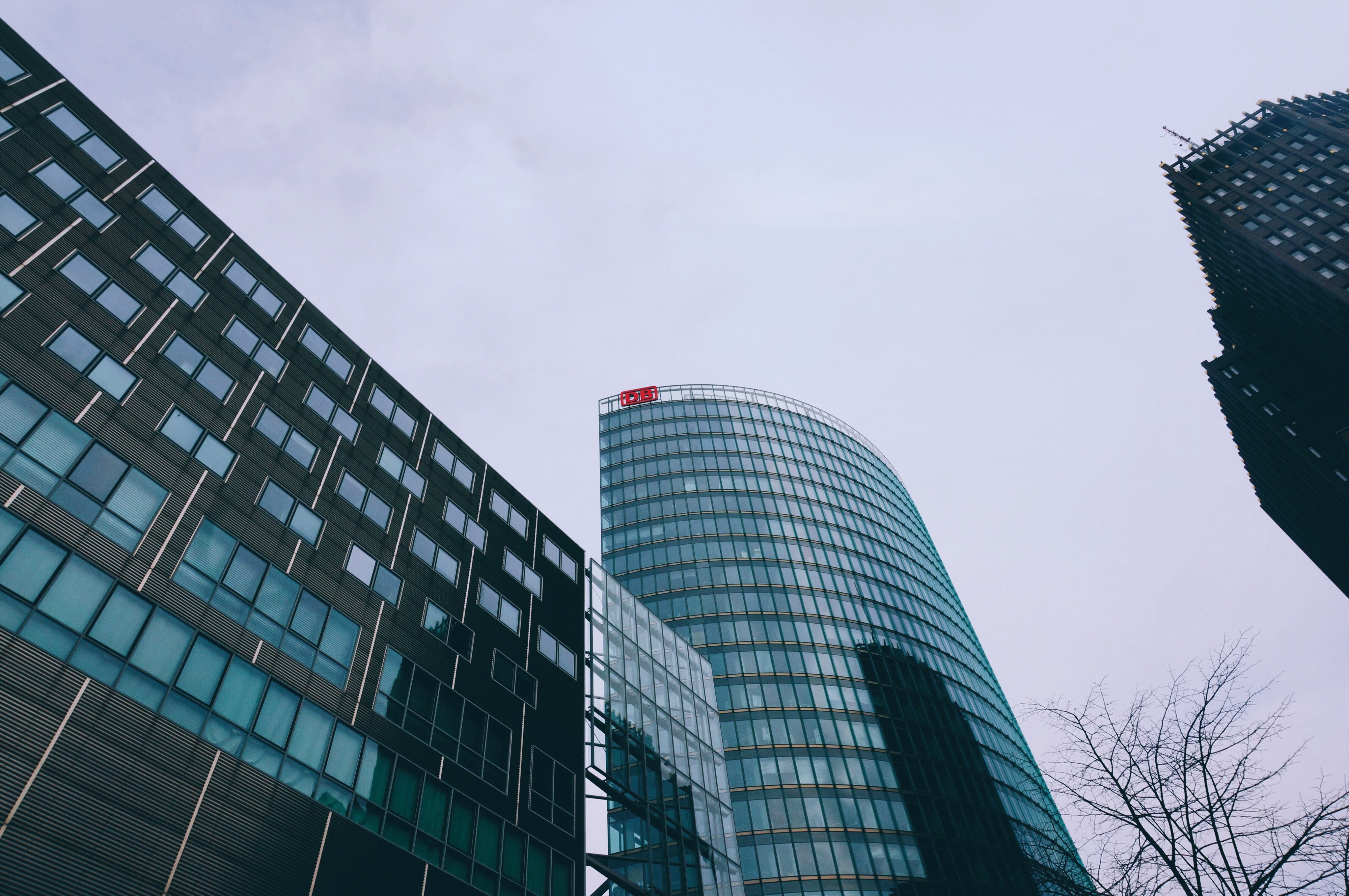 Modern skyscrapers in a city under a cloudy sky HD Wallpaper