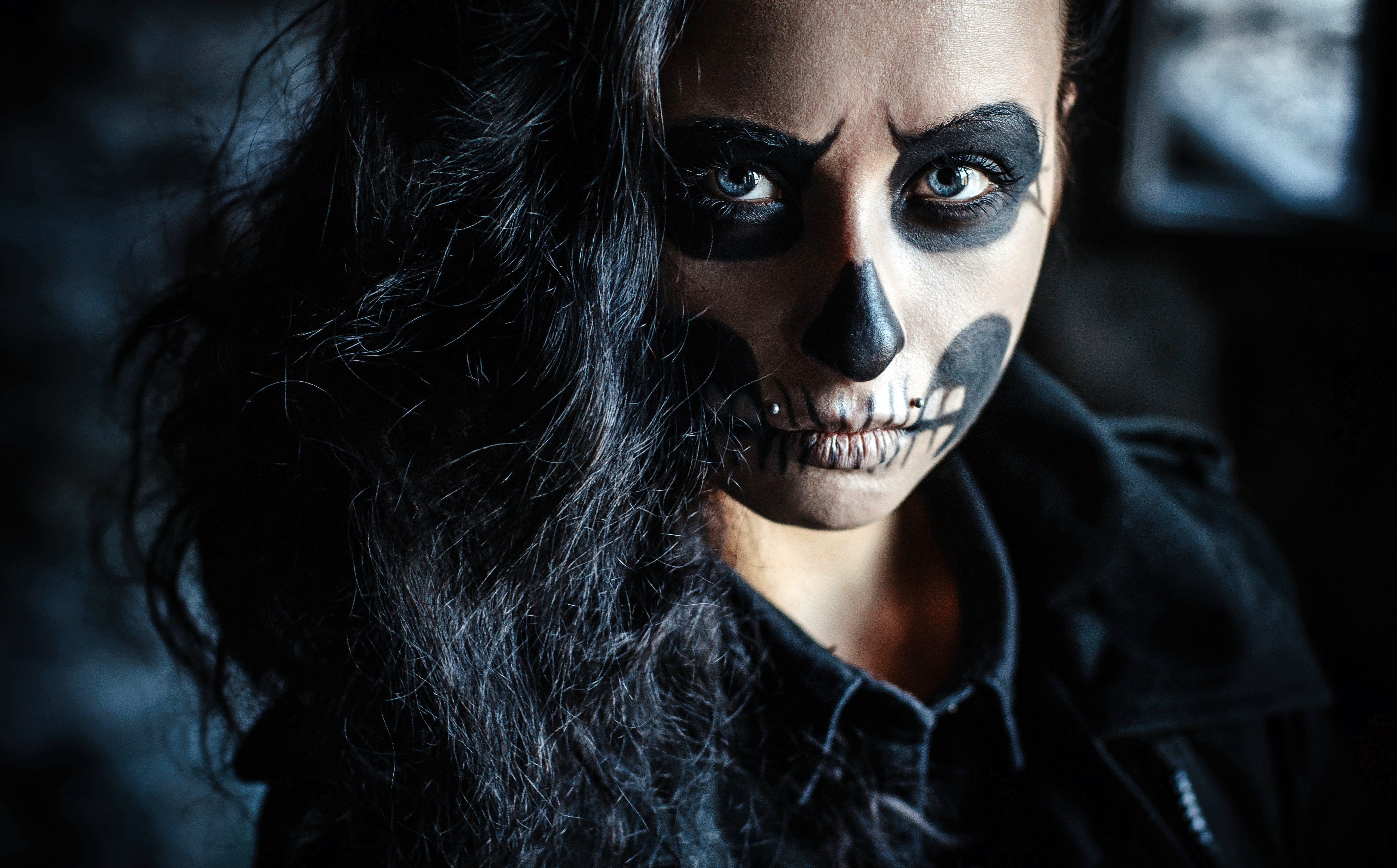 Woman with skull face paint and piercings HD Wallpaper