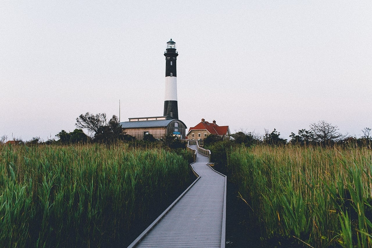 Fire Island Lighthouse and boardwalk through marsh HD Wallpaper