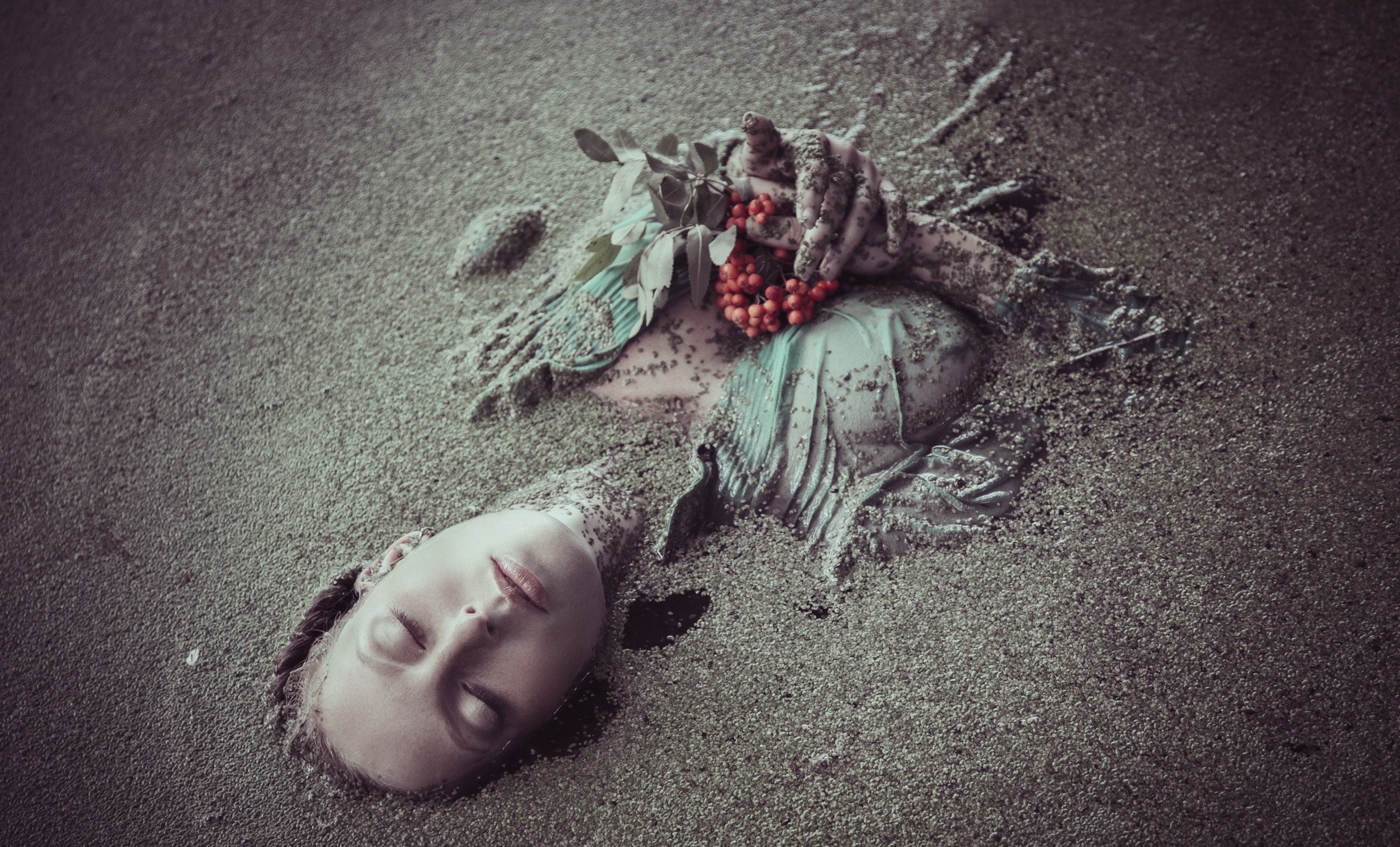 Woman buried in sand with berries and leaves HD Wallpaper