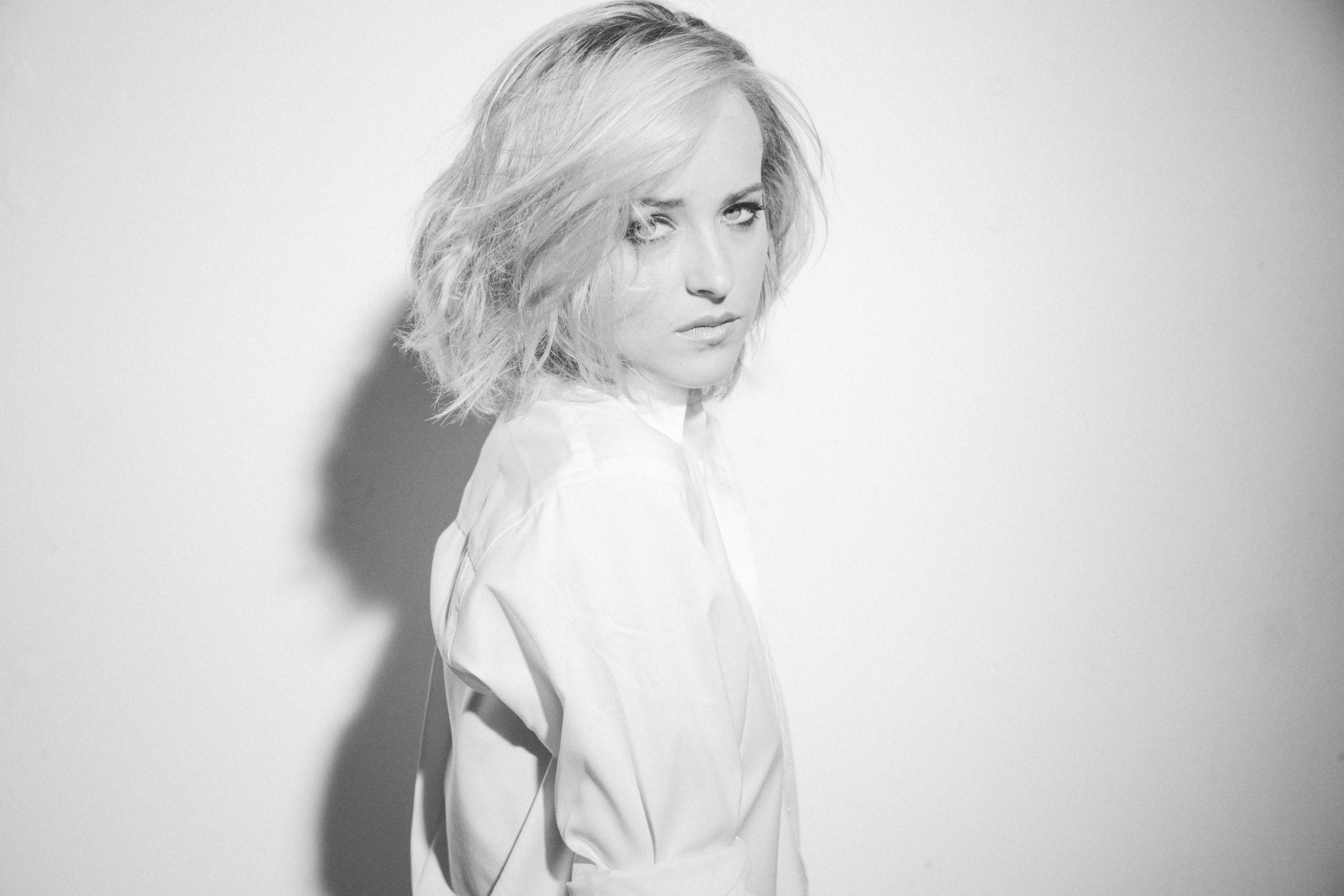 Dakota Johnson in a white shirt, black and white portrait HD Wallpaper