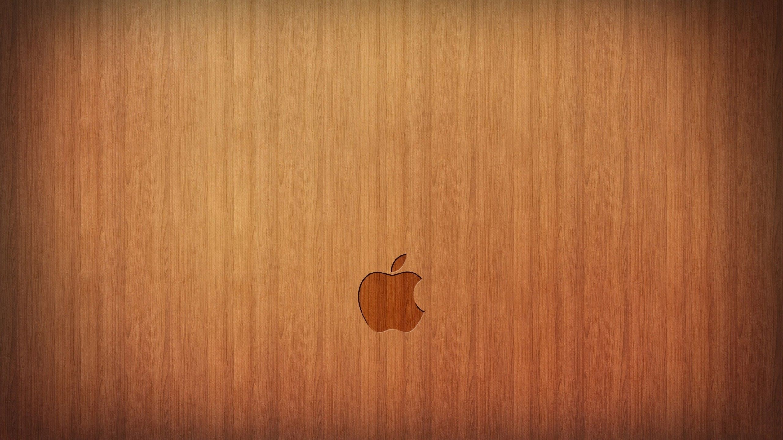 Apple logo on a wooden surface HD Wallpaper