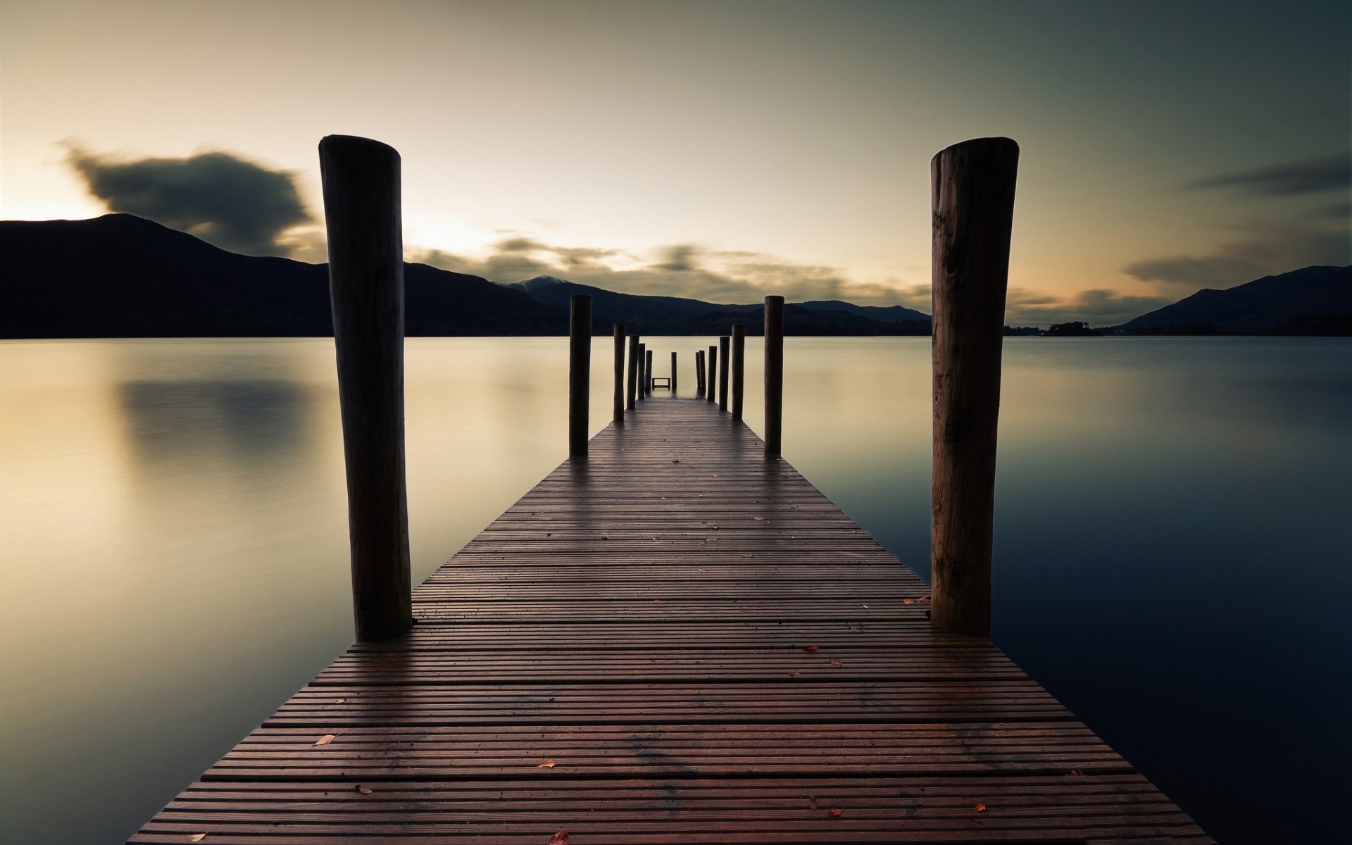 Wooden pier on a calm lake at sunset HD Wallpaper