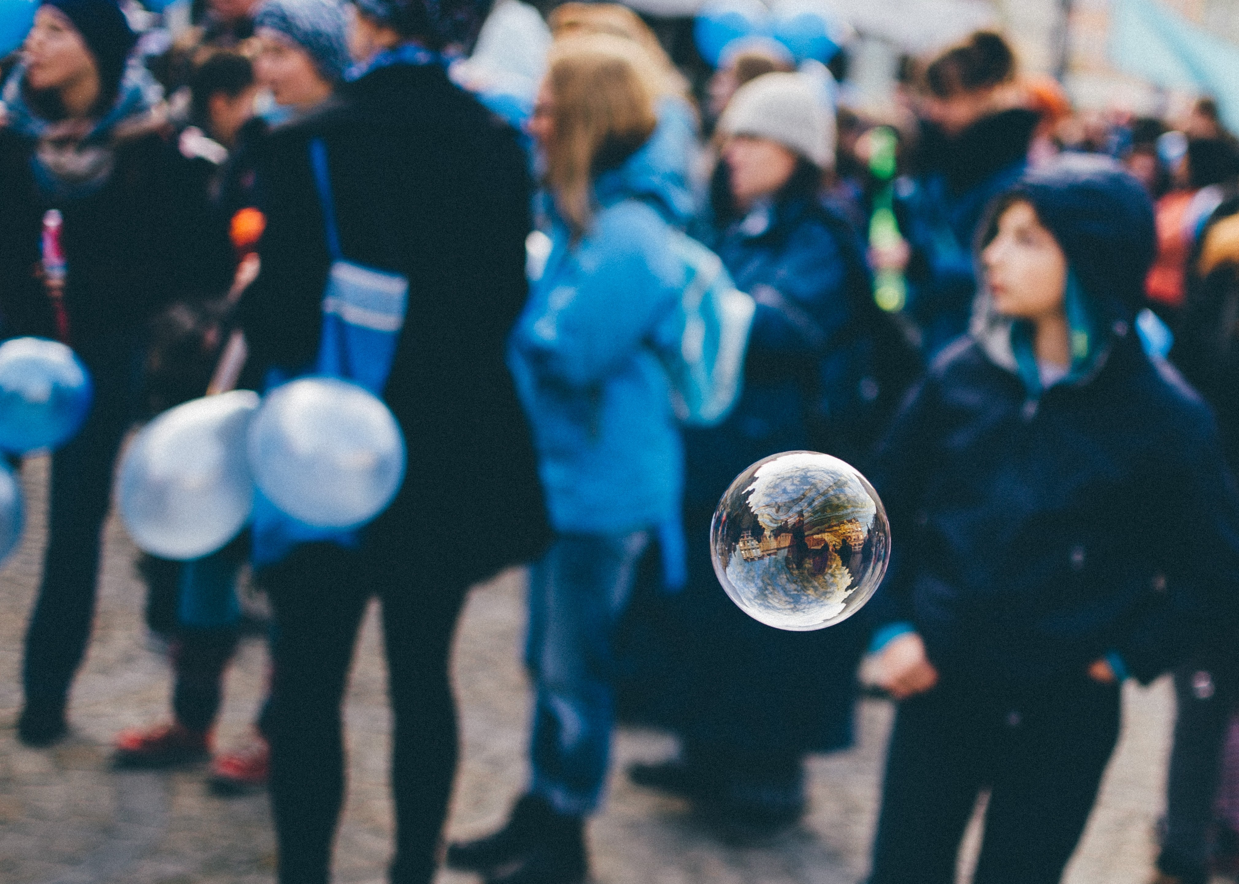 People at a festival with balloons and a bubble HD Wallpaper