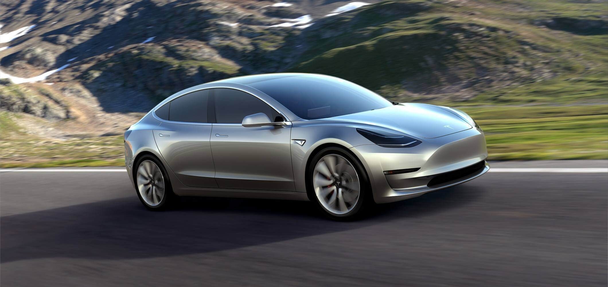Silver Tesla Model 3 driving on a mountain road HD Wallpaper