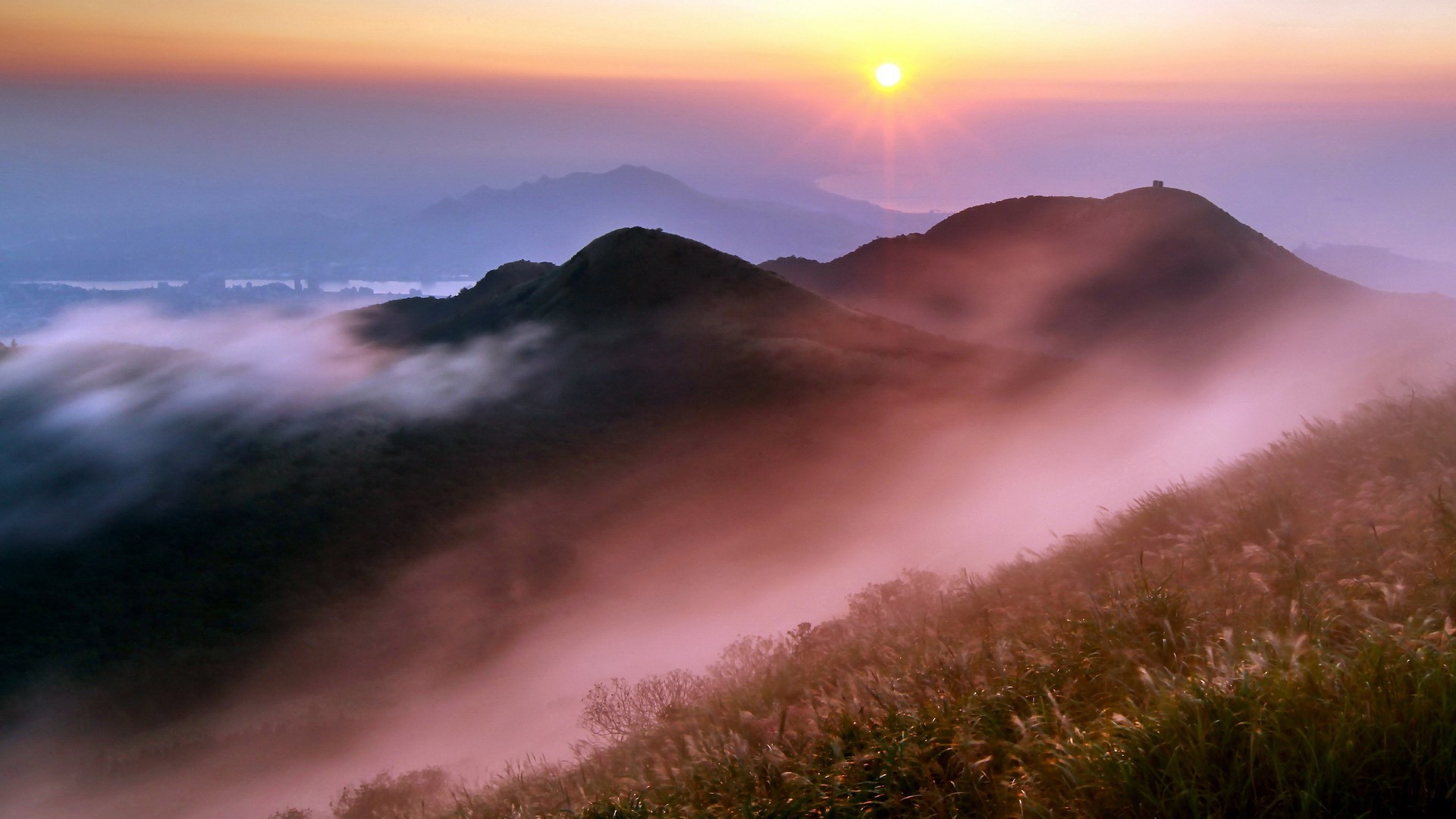 Misty mountains at sunrise with golden sun HD Wallpaper
