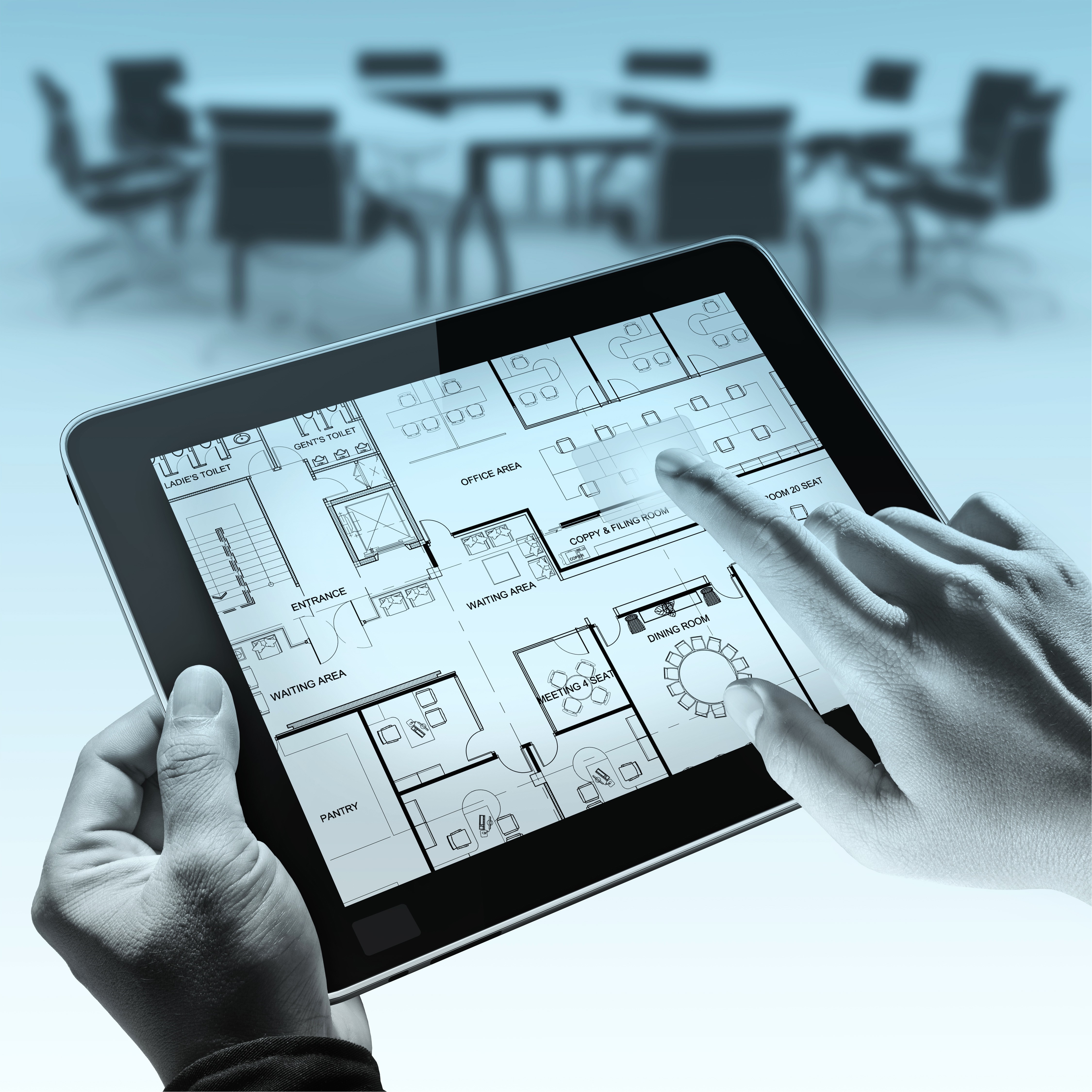 Hands holding tablet displaying office floor plan HD Wallpaper